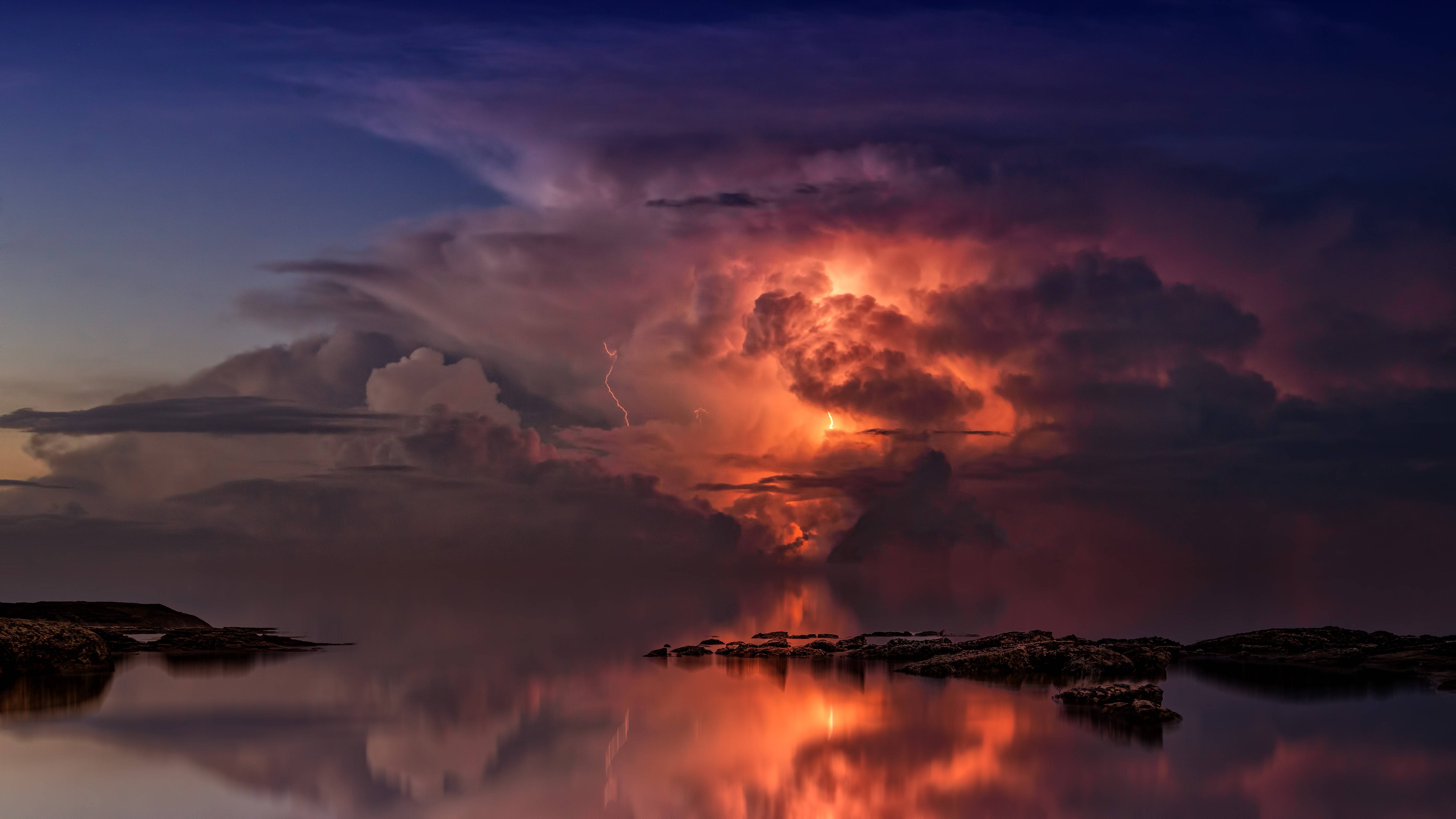 Thunderstorm over the coast at twilight HD Wallpaper