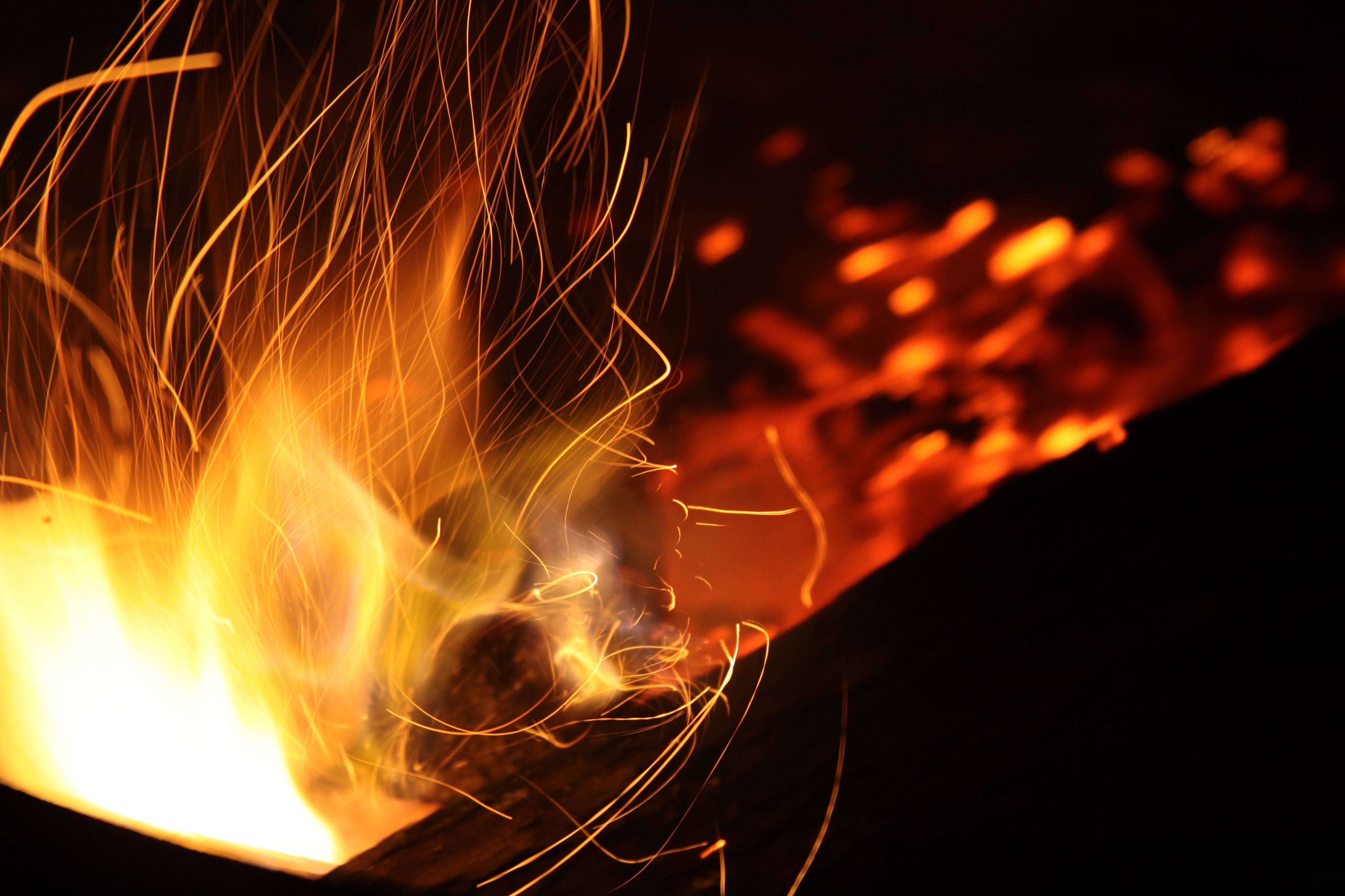 Abstract image of a bonfire with sparks HD Wallpaper
