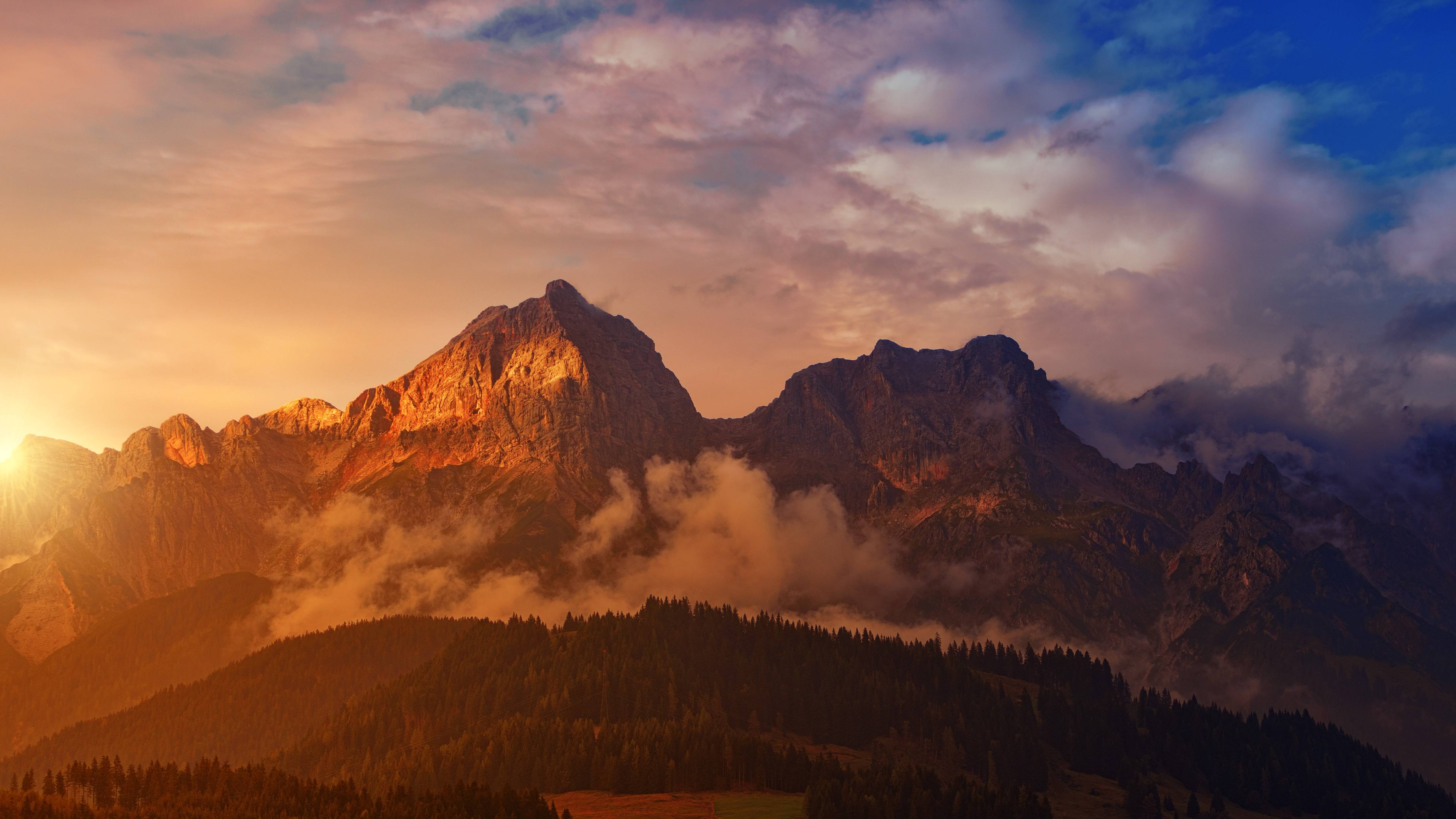 Sunset over majestic alpine mountains with clouds HD Wallpaper