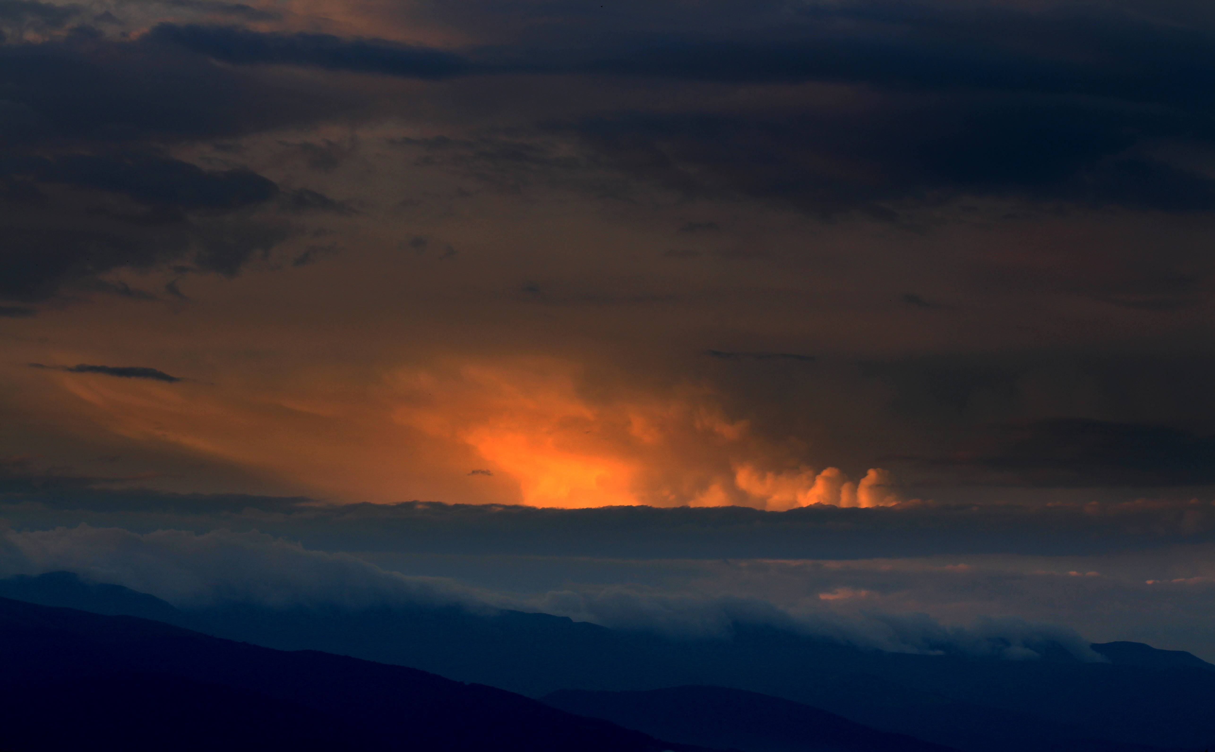 Dramatic sunset clouds over mountains HD Wallpaper