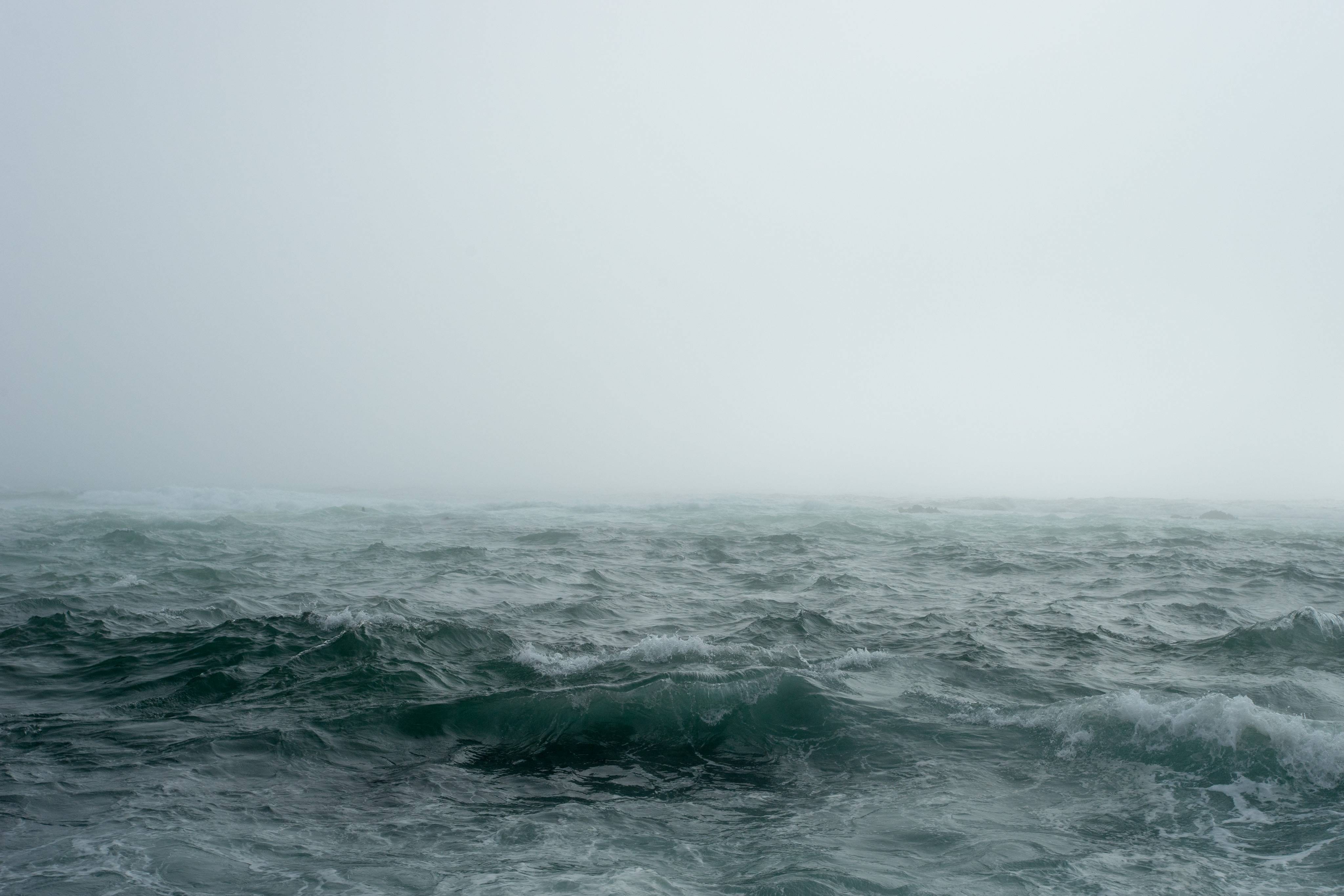 Stormy ocean waves in thick fog HD Wallpaper