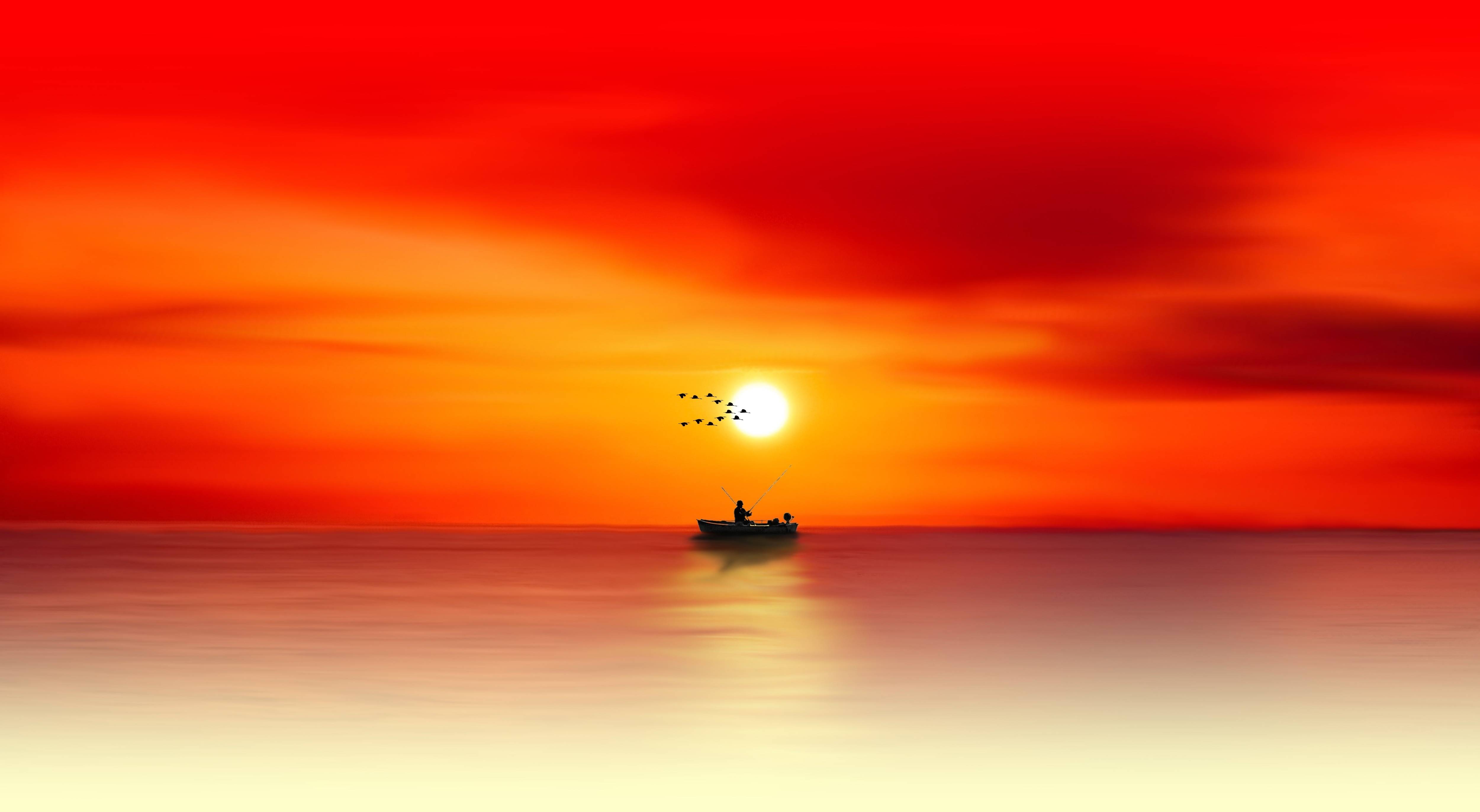 Fisherman in a boat at sunset over the sea HD Wallpaper