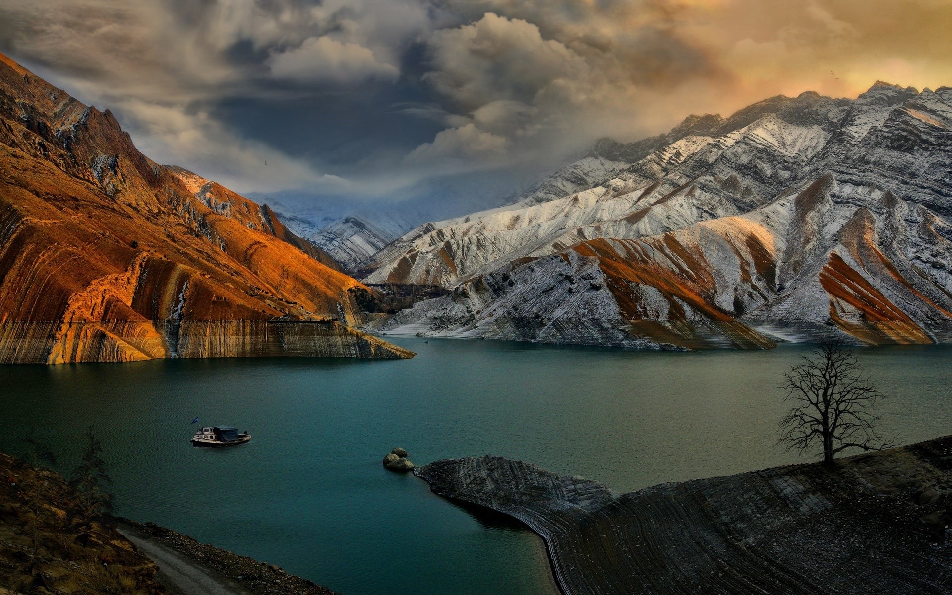 Boat on a lake with snow-capped mountains HD Wallpaper