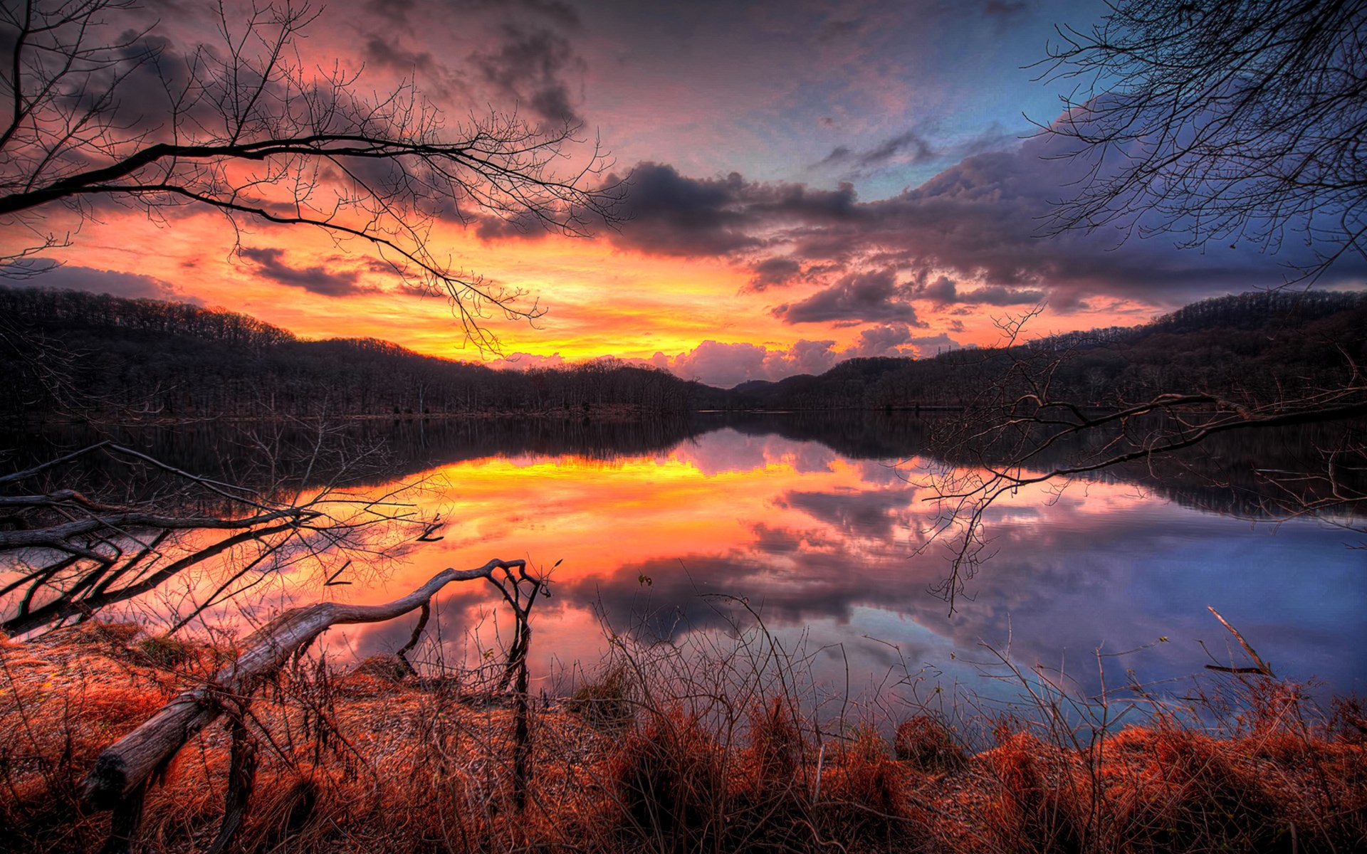 Sunset over a lake with reflections HD Wallpaper