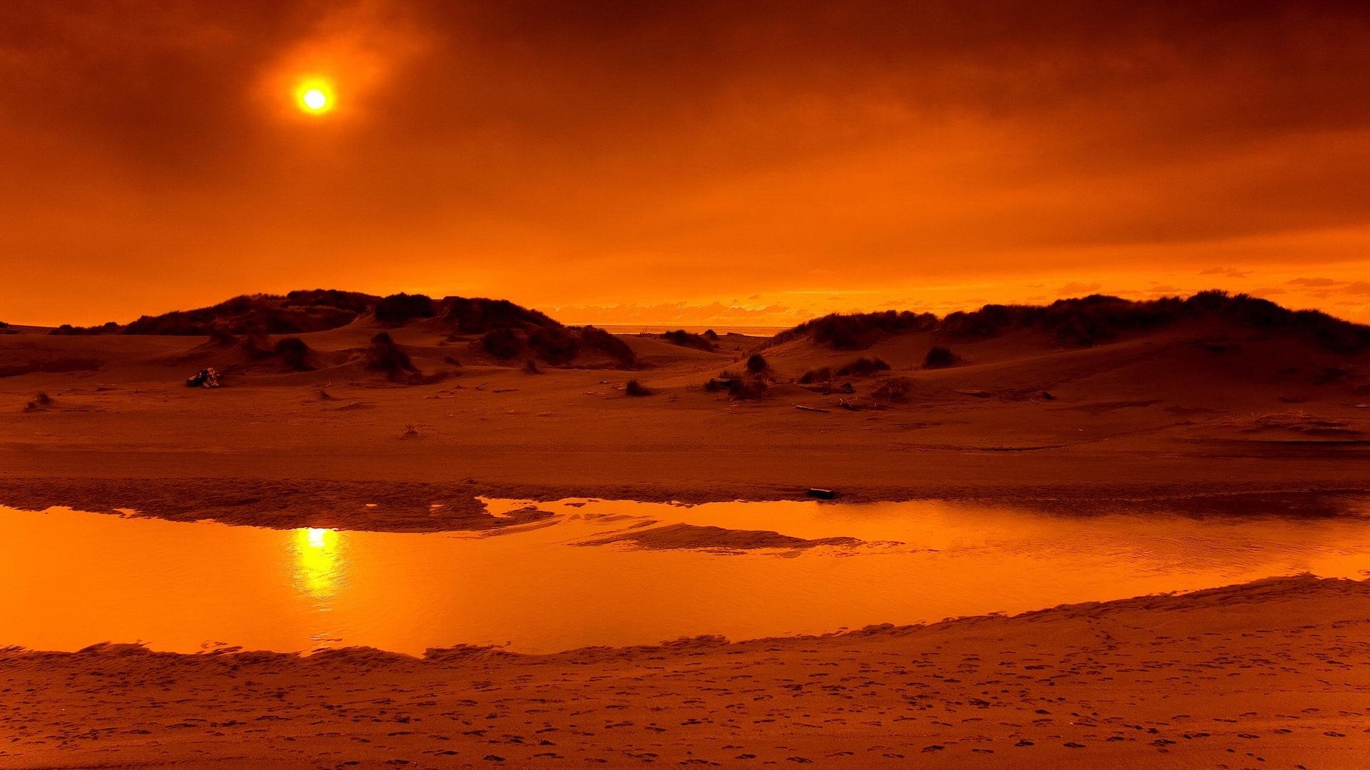 Orange desert landscape with sun and water HD Wallpaper