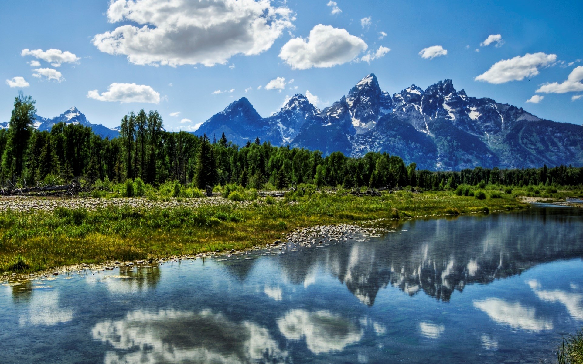 Mountains reflected in a river with trees and clouds HD Wallpaper