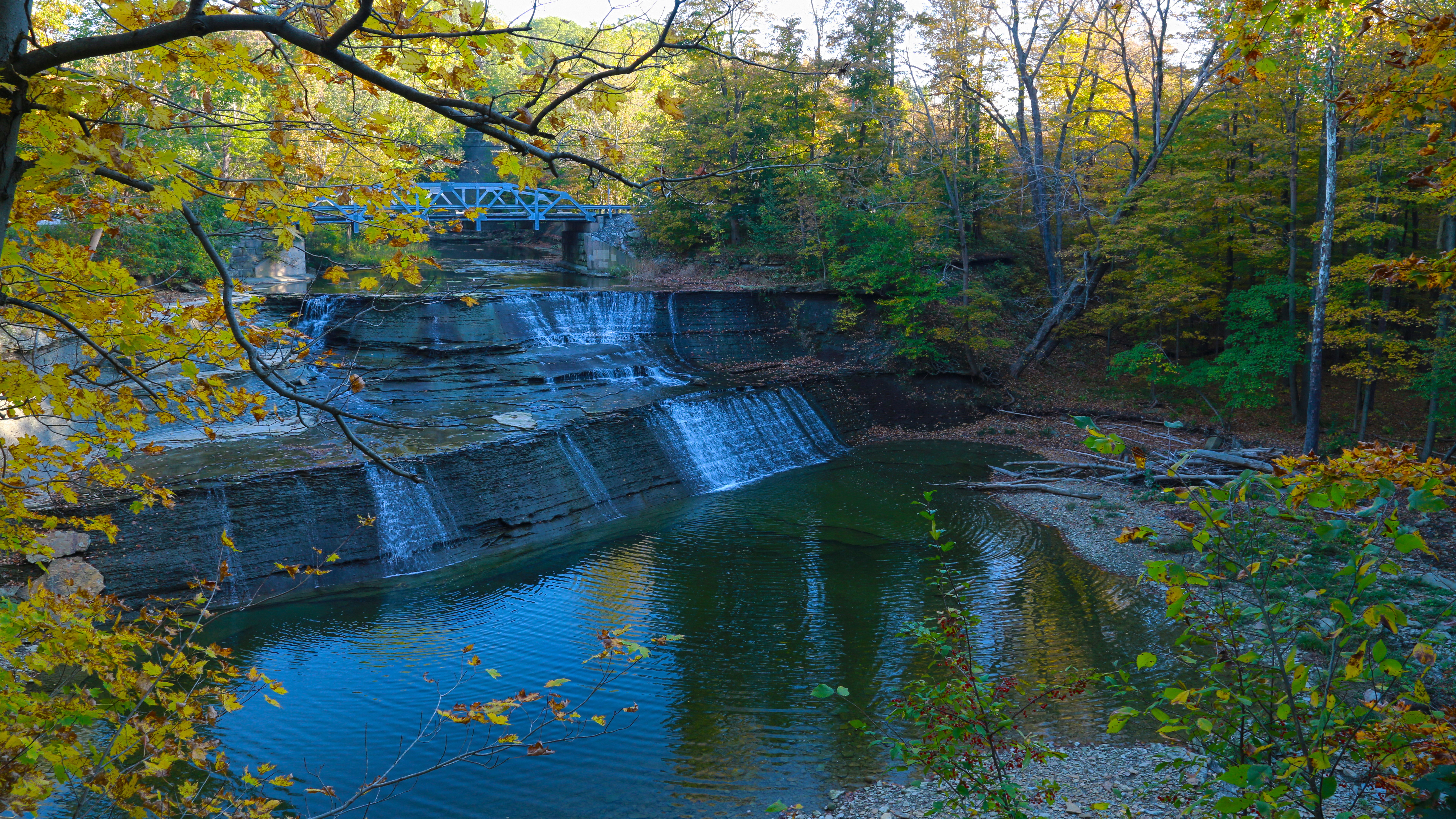 Waterfall in a forest during autumn HD Wallpaper