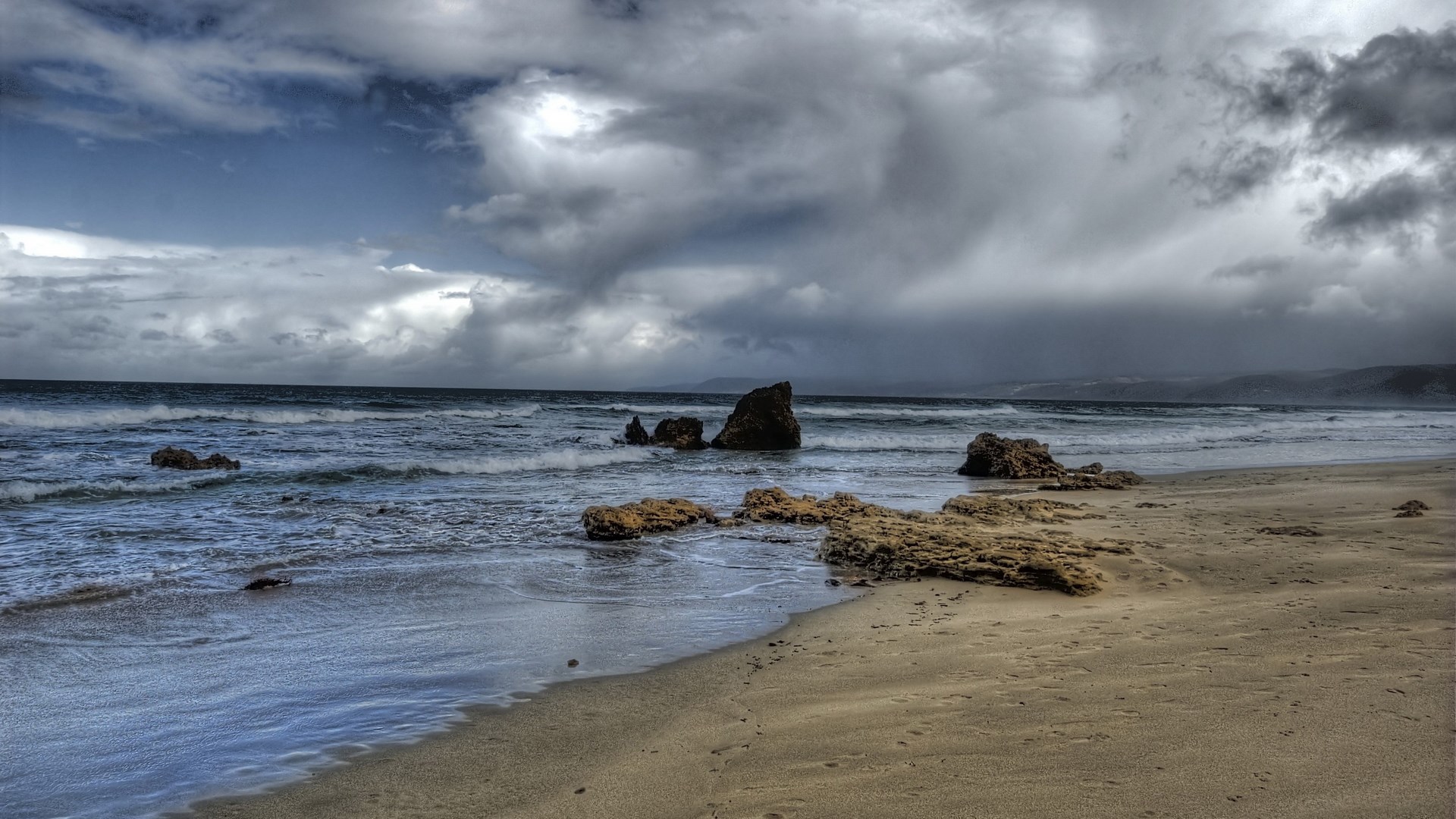 Stormy Beach with Rocks and Waves HD Wallpaper