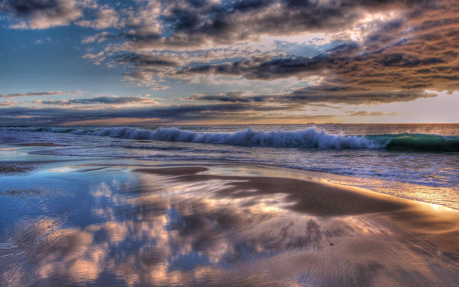 Beach with waves and reflections at sunset HD Wallpaper