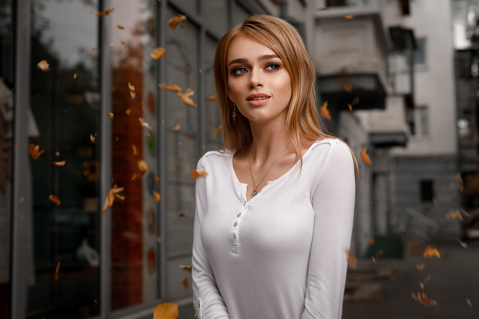 Blonde girl in white shirt with falling leaves HD Wallpaper