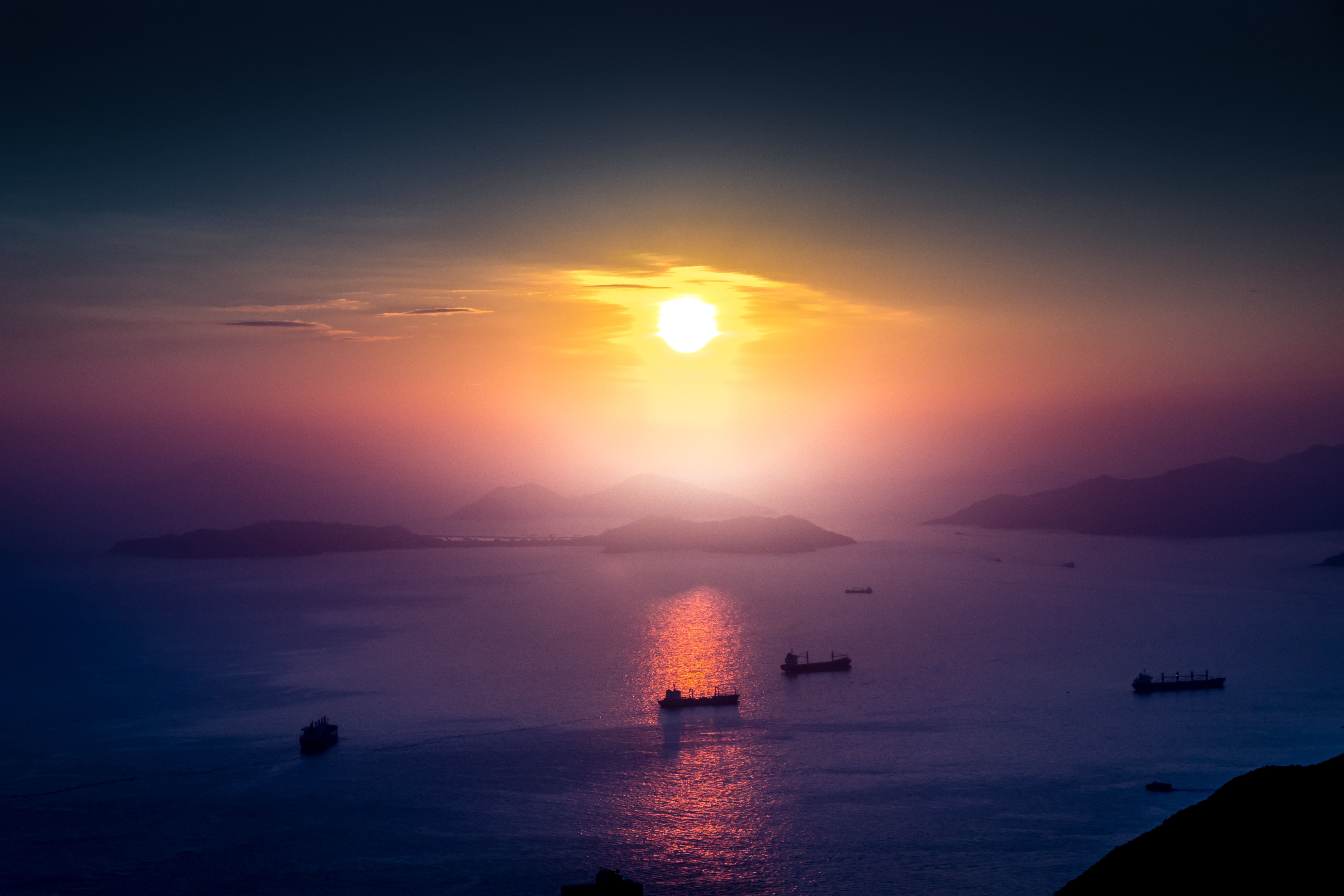 Ships on the sea at sunrise with mountains HD Wallpaper