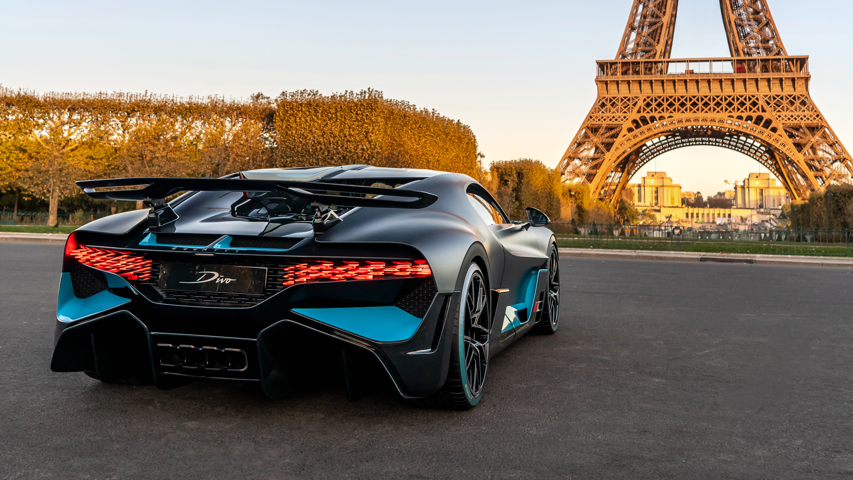 Bugatti Divo parked in front of the Eiffel Tower HD Wallpaper