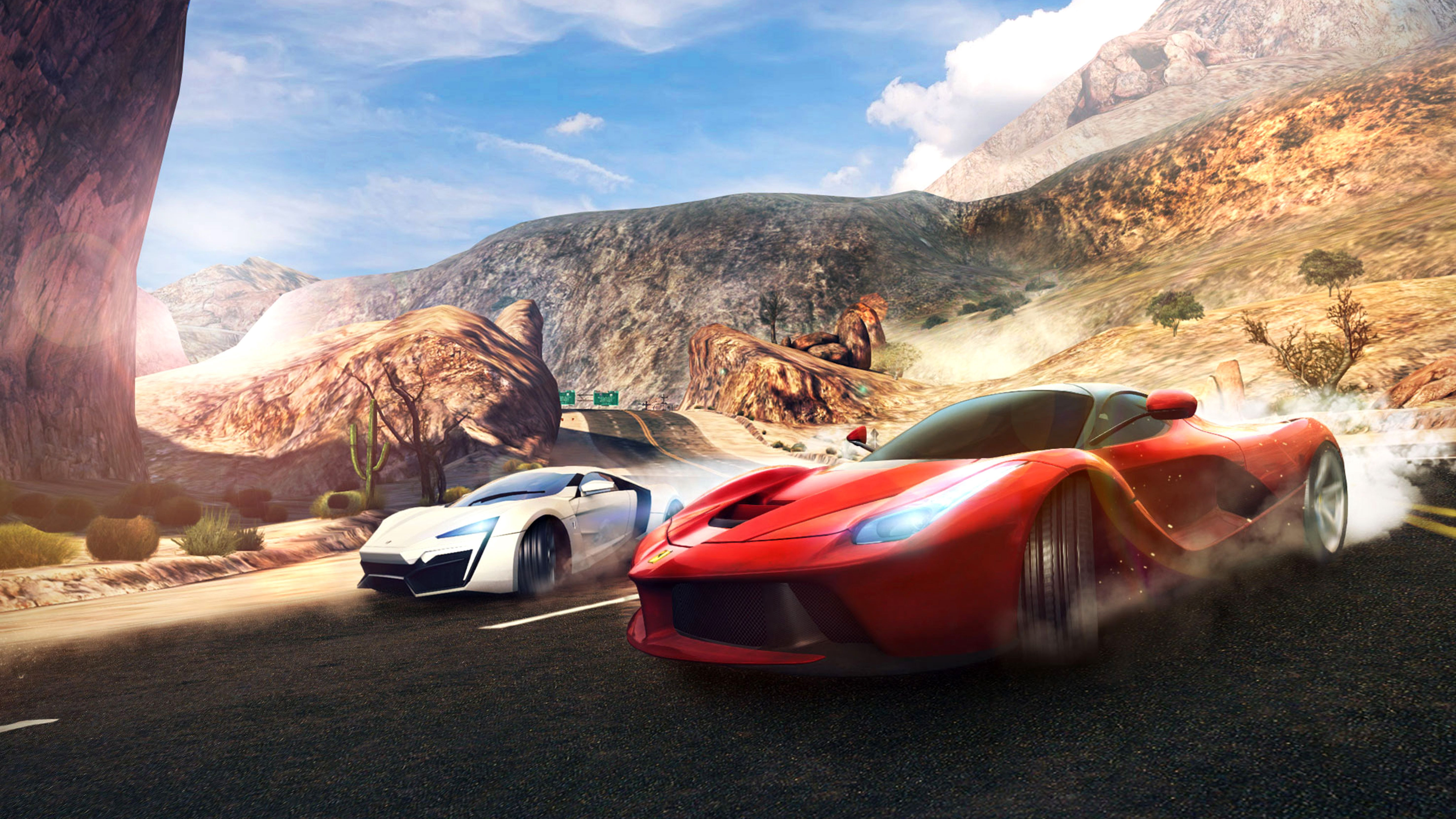 Red and white sports cars racing on a desert road HD Wallpaper