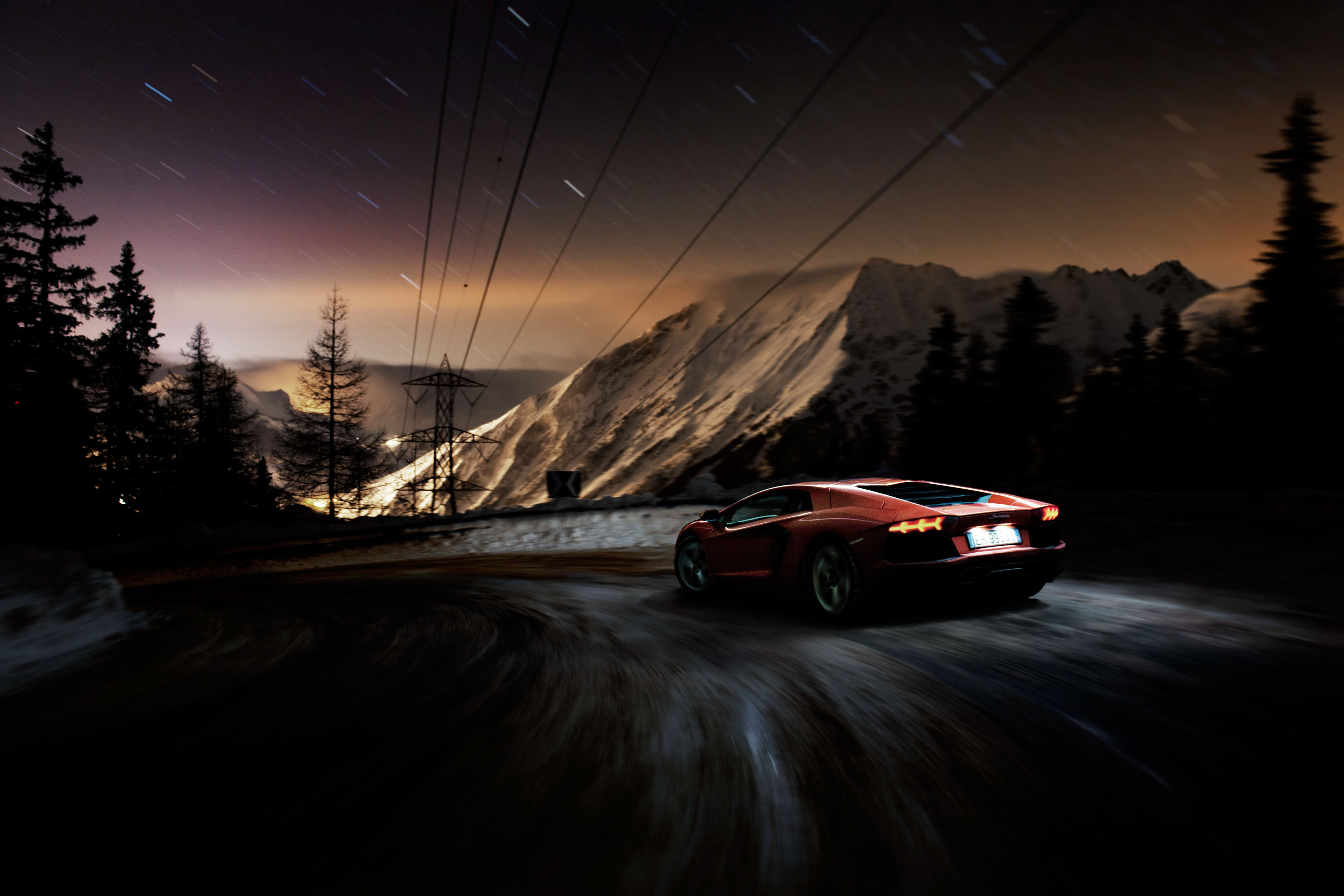 Red Lamborghini Aventador driving on a mountain road at night HD Wallpaper