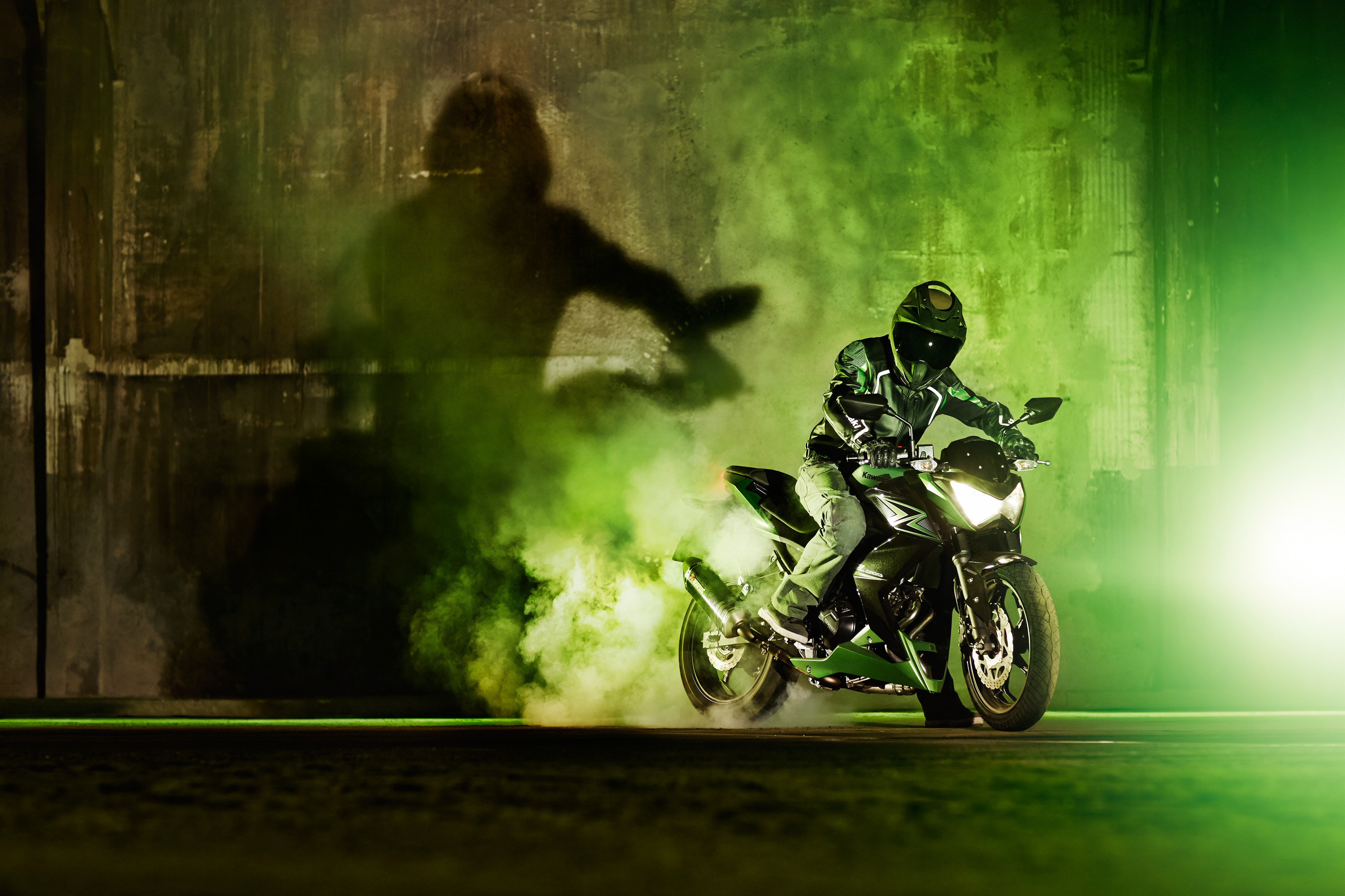 Kawasaki Z300 motorcycle drifting with green smoke HD Wallpaper