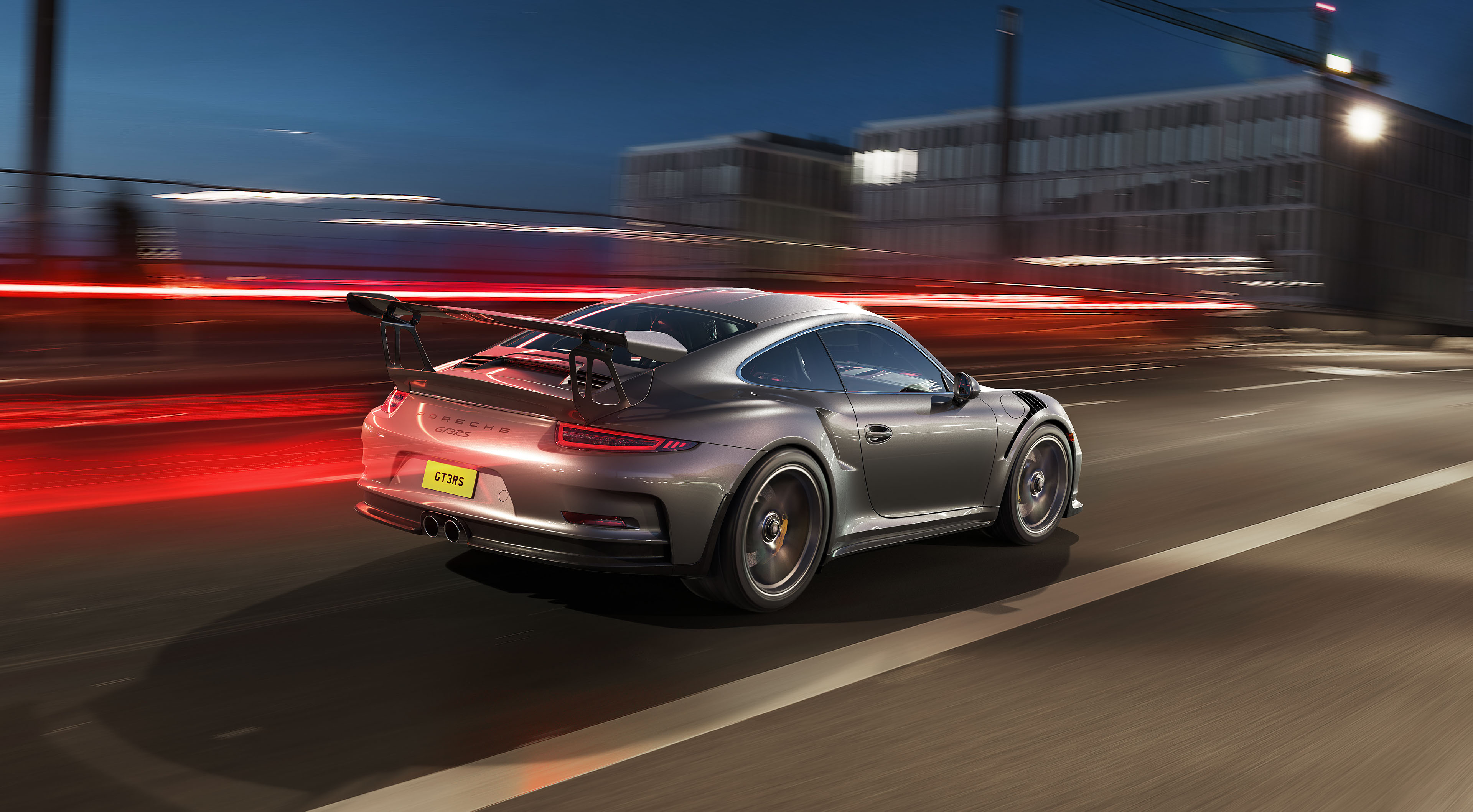 Porsche GT3 RS driving on a city street at night HD Wallpaper