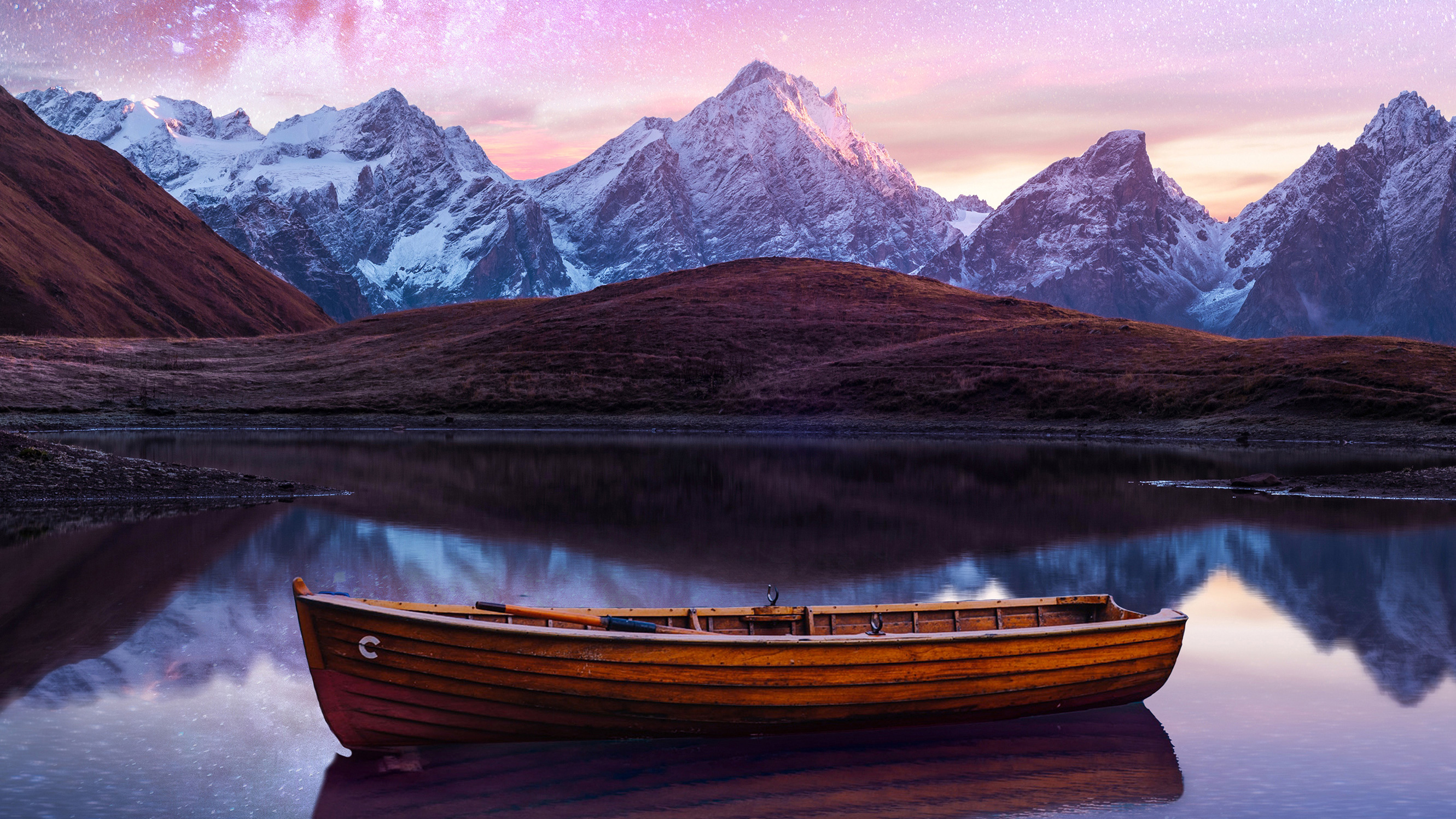 Wooden boat on a lake with mountains and starry sky HD Wallpaper