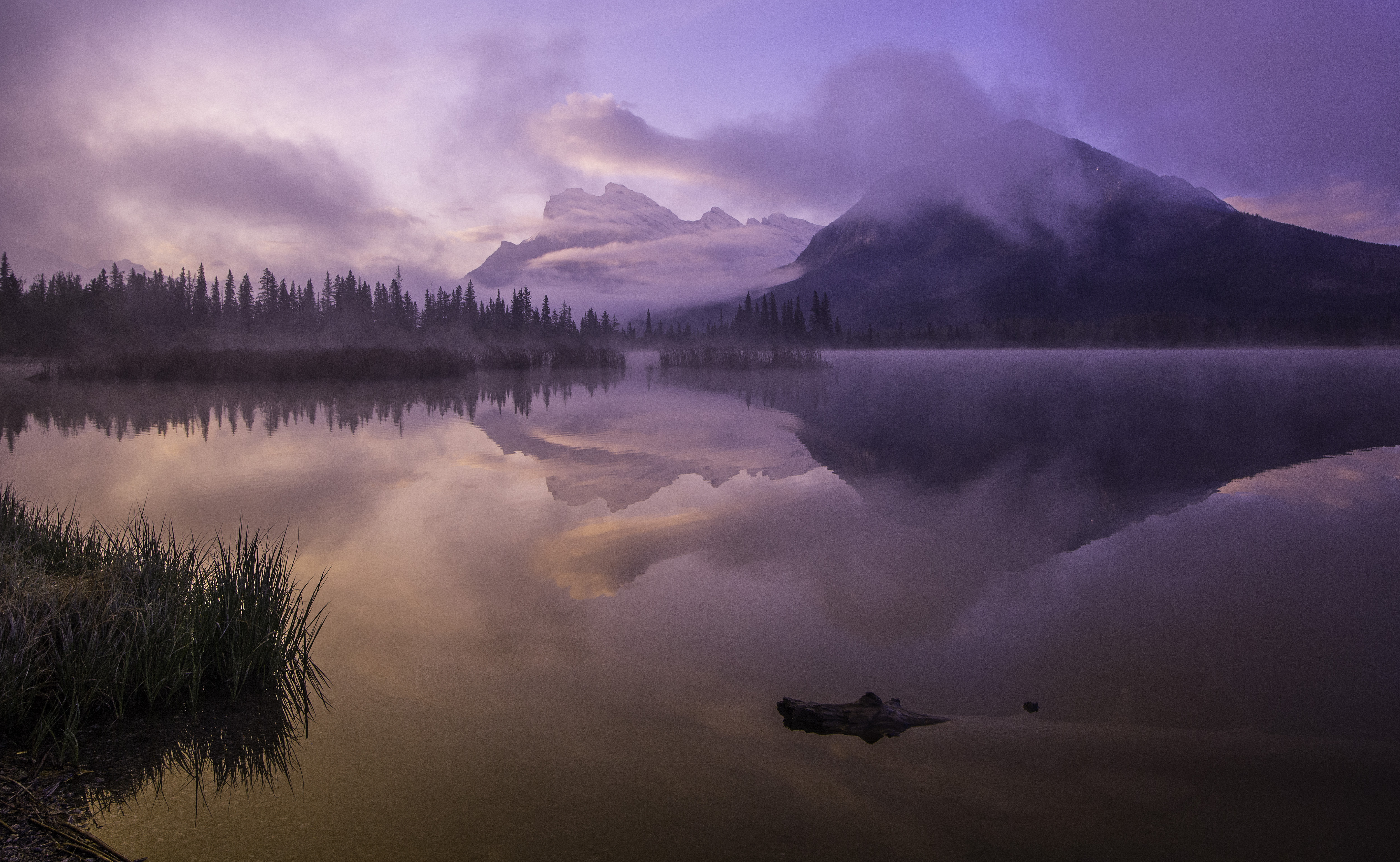 Sunrise over a misty lake with mountains HD Wallpaper