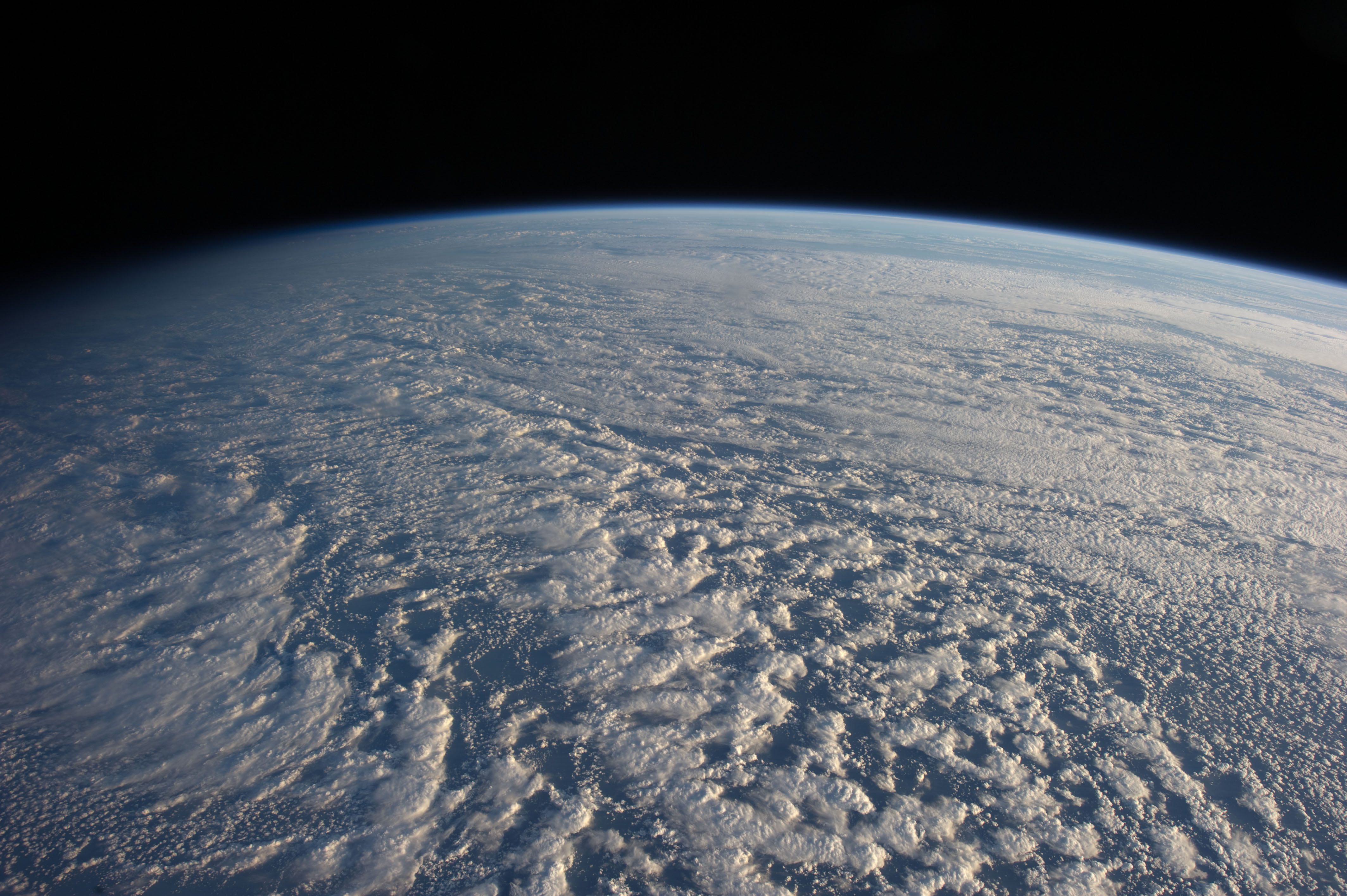 View of Earth's atmosphere and clouds from space HD Wallpaper