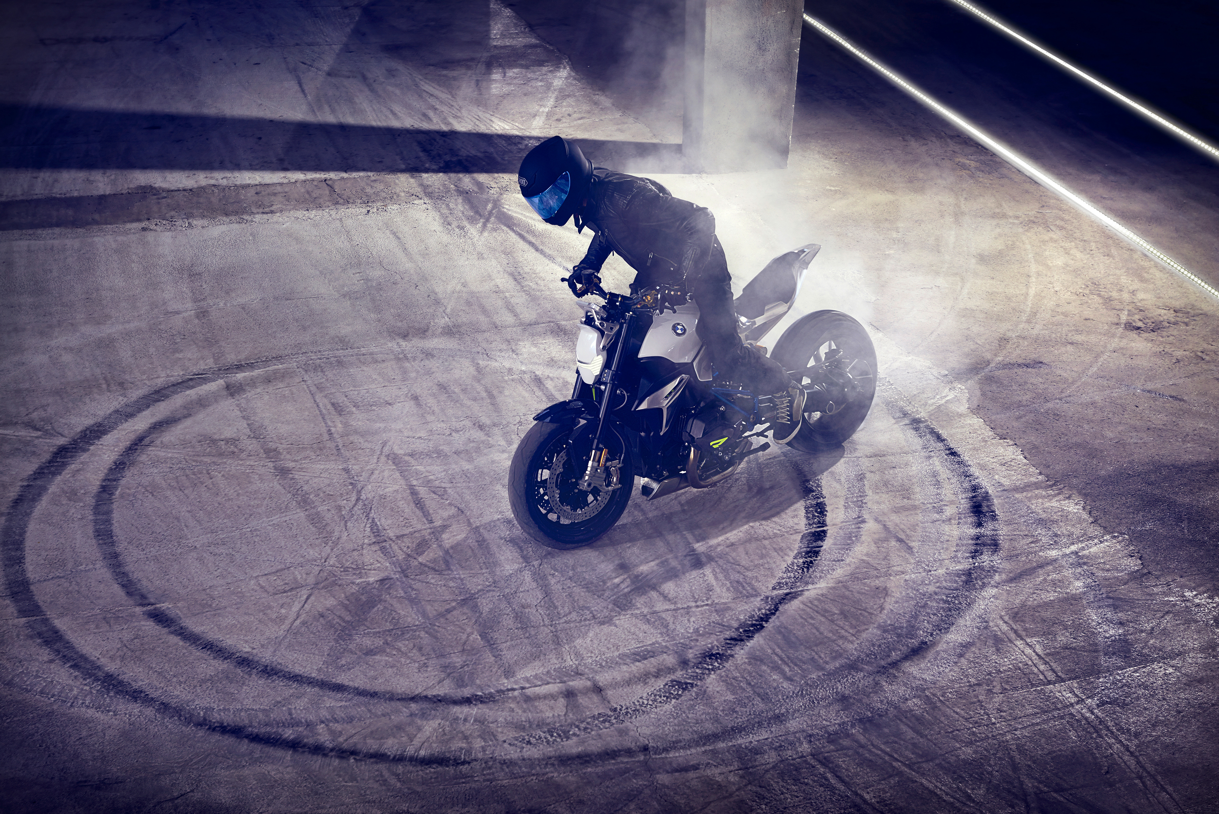 BMW motorcycle doing a burnout with smoke HD Wallpaper
