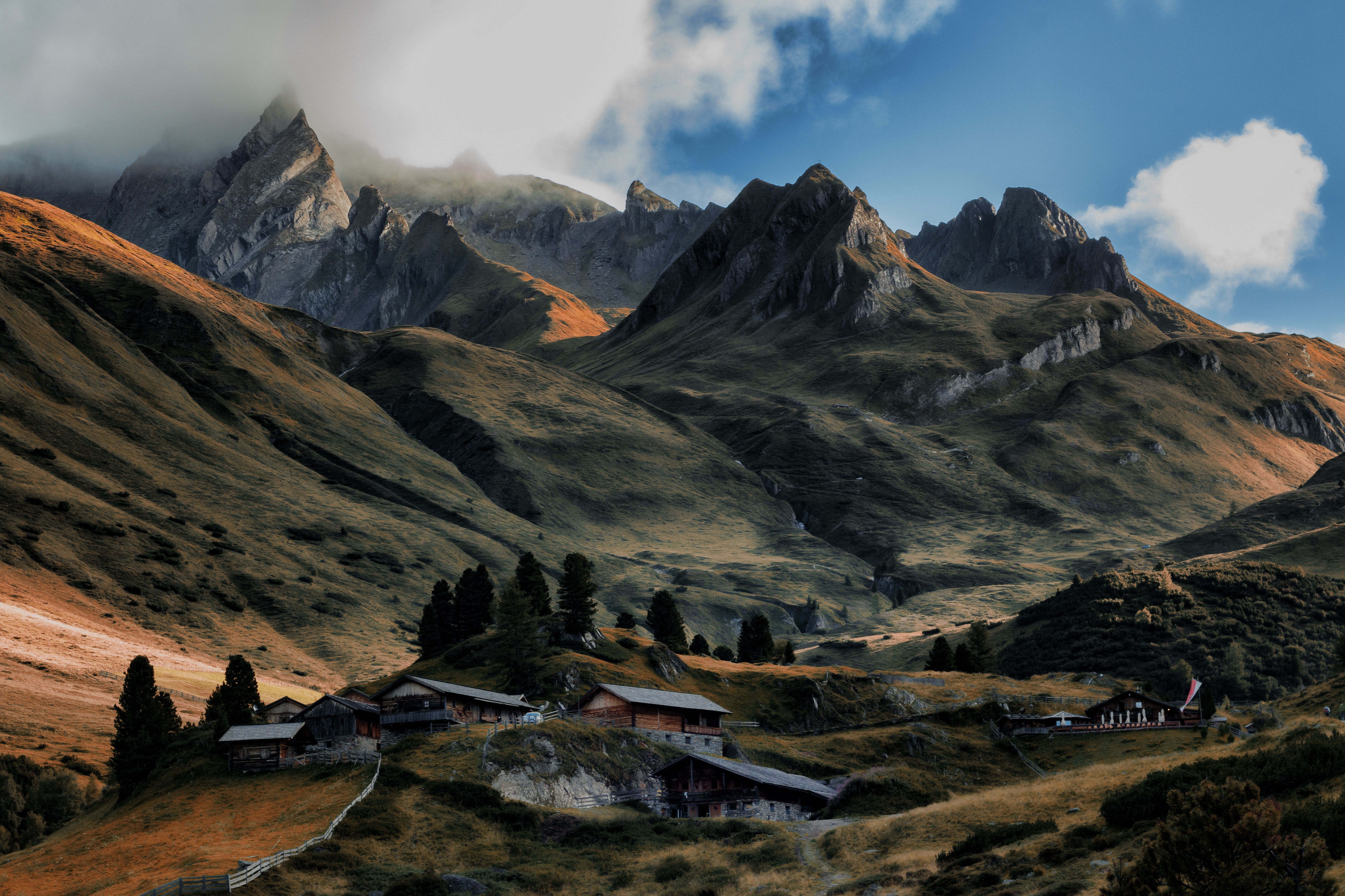 Mountain Village Nestled in Scenic Alpine Landscape 4K HD Wallpaper
