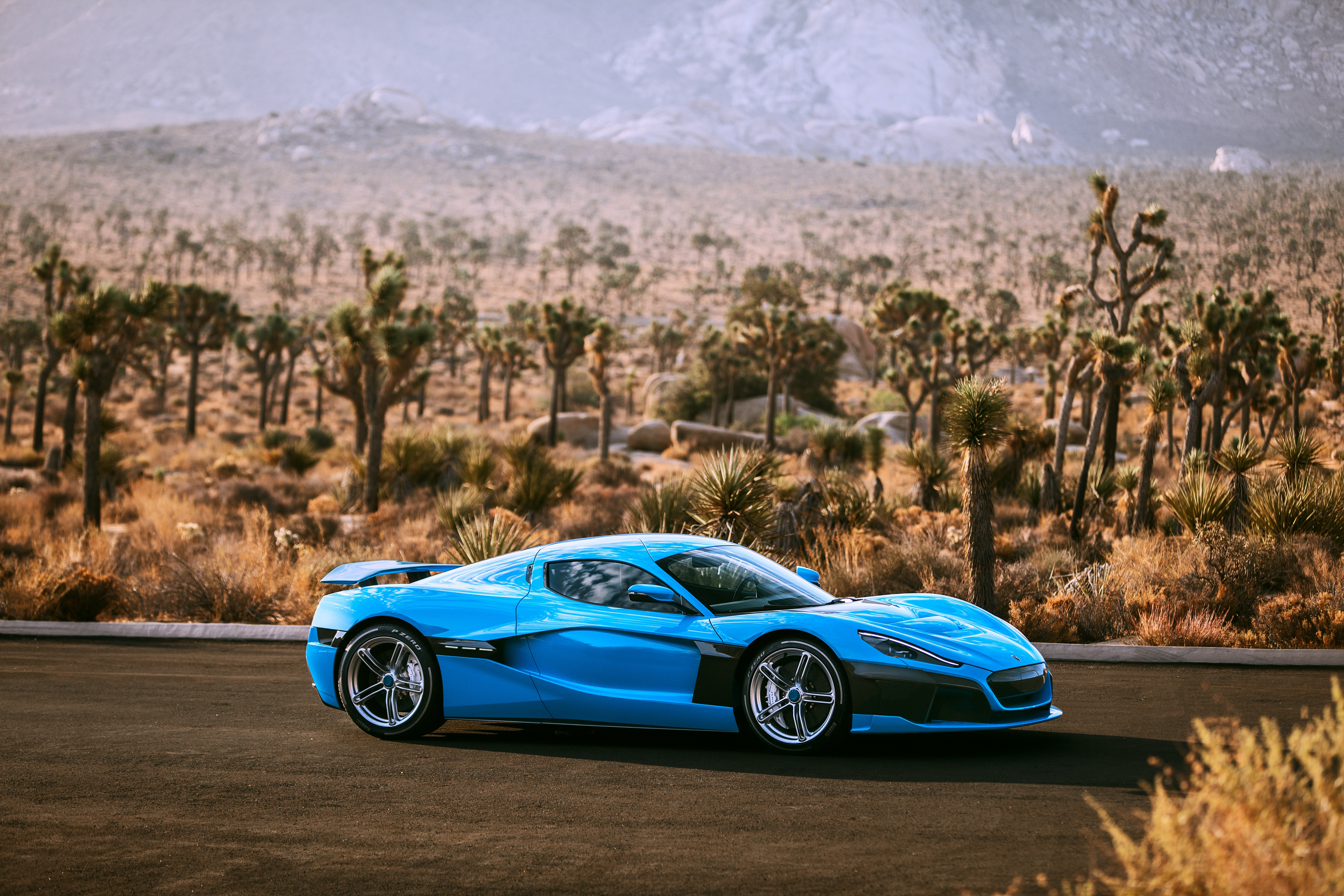 Rimac C Two electric car in desert landscape HD Wallpaper