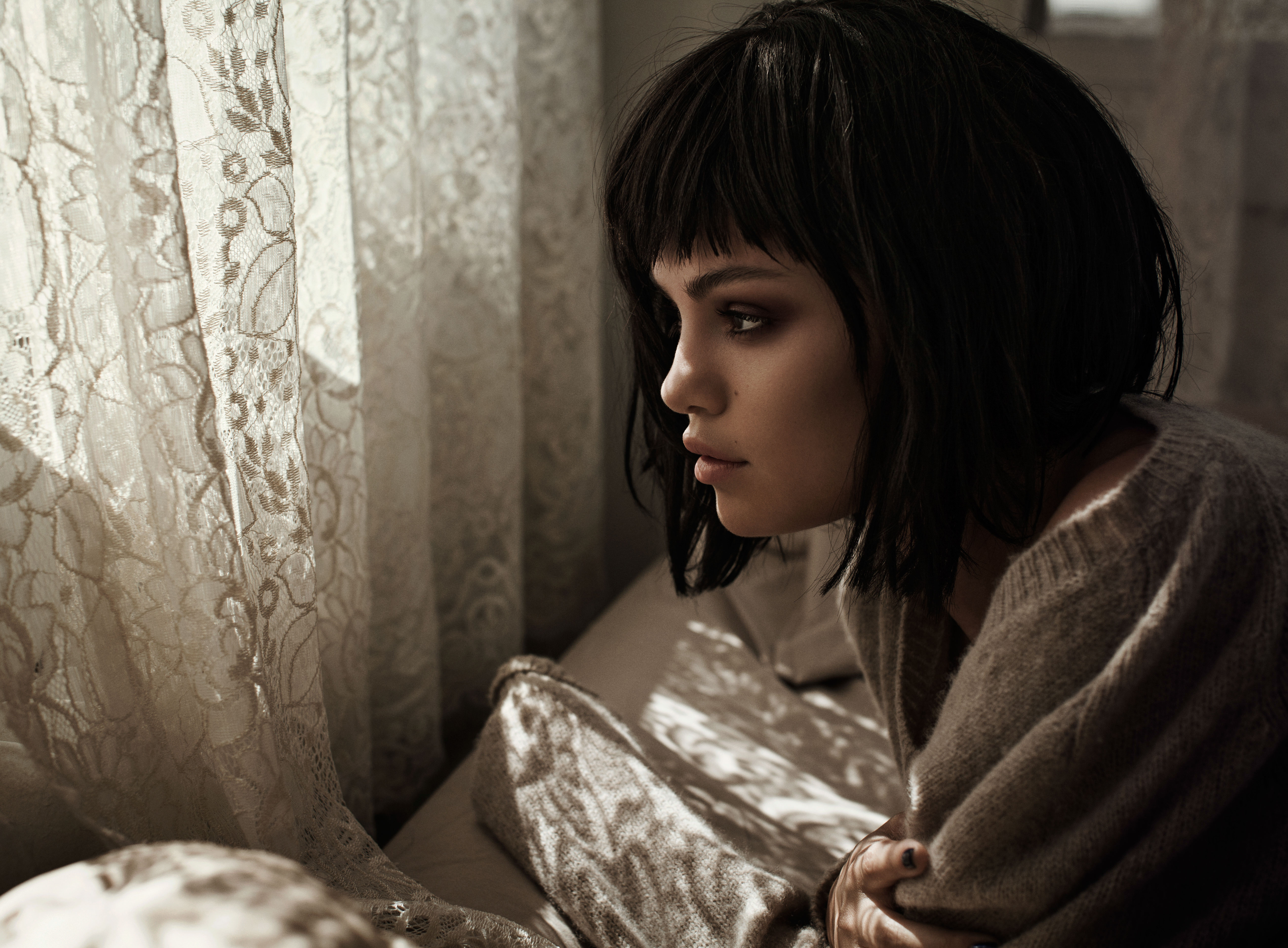 Selena Gomez in a sweater by the window HD Wallpaper