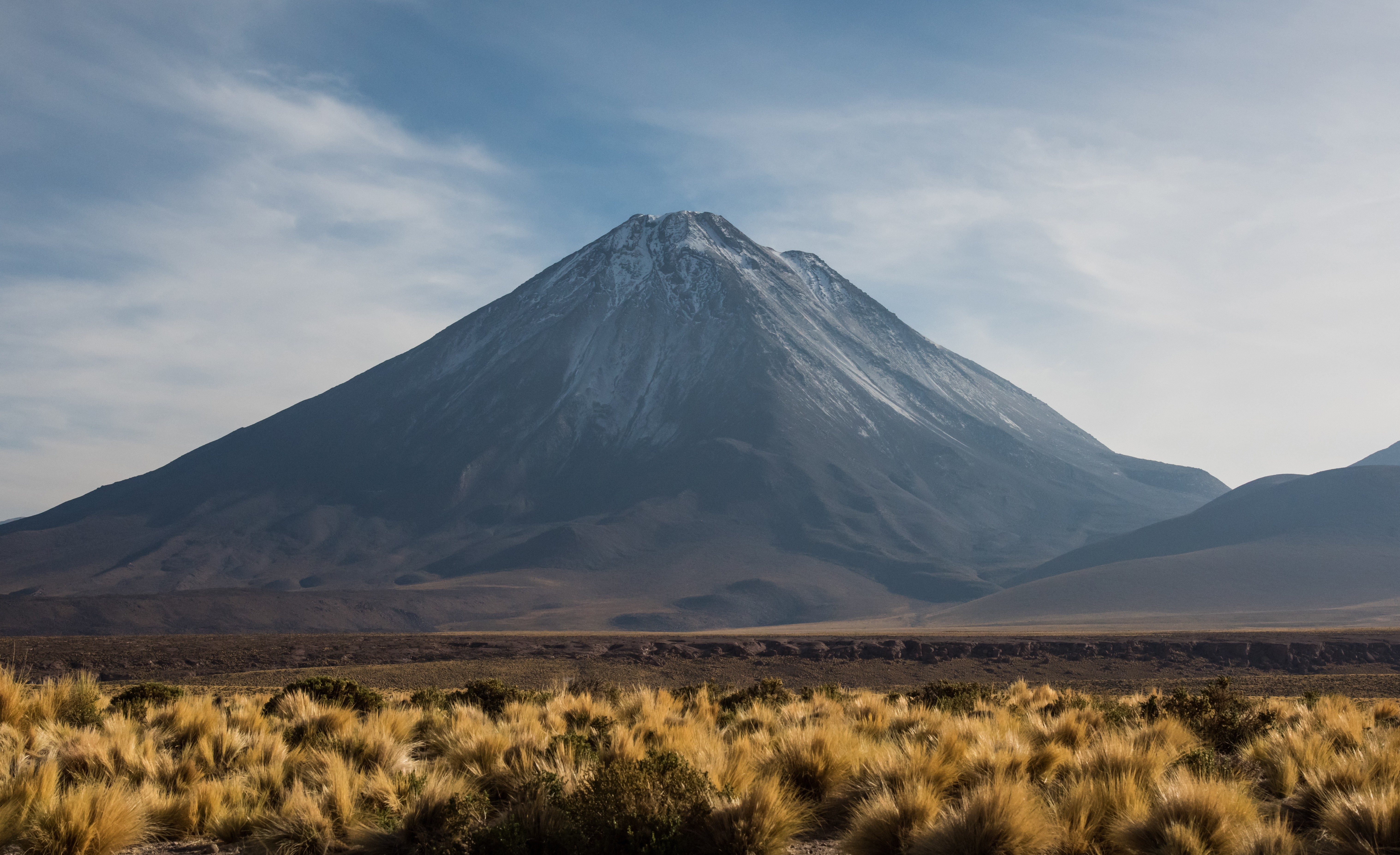 Volcano landscape with dry grass and mountains HD Wallpaper