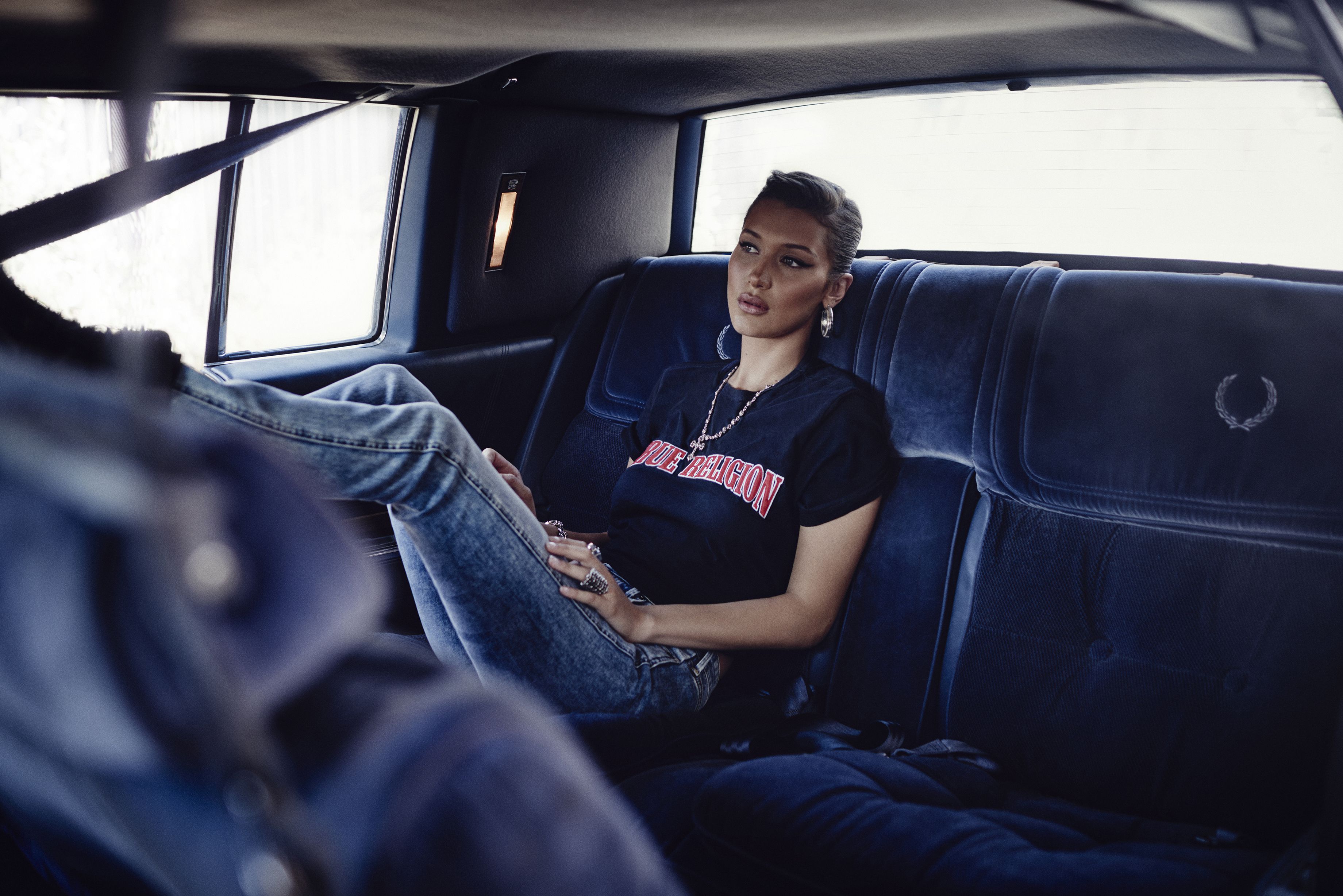 Bella Hadid in a car wearing True Religion HD Wallpaper