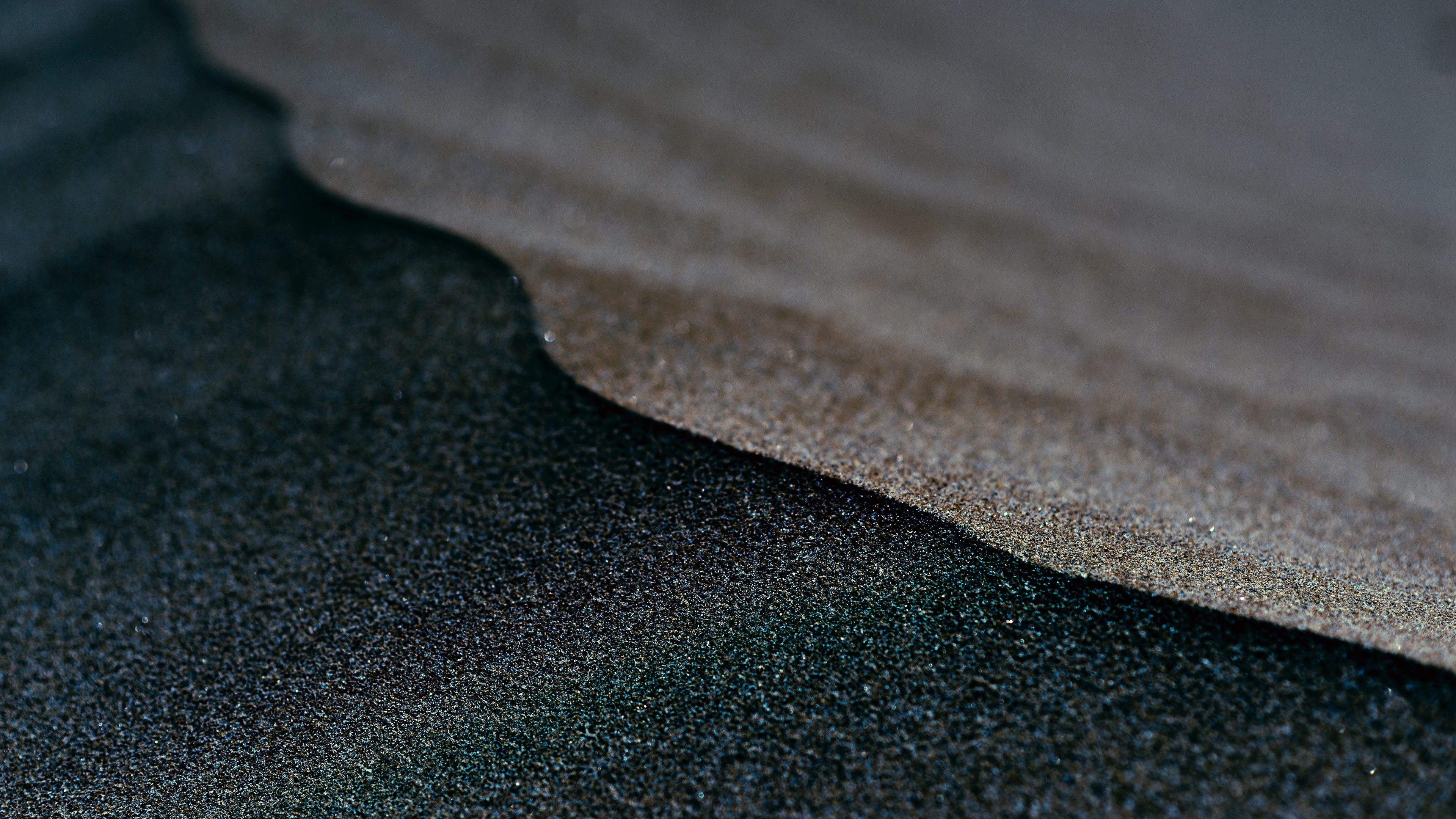 Close-up of wet and dry sand on a beach HD Wallpaper