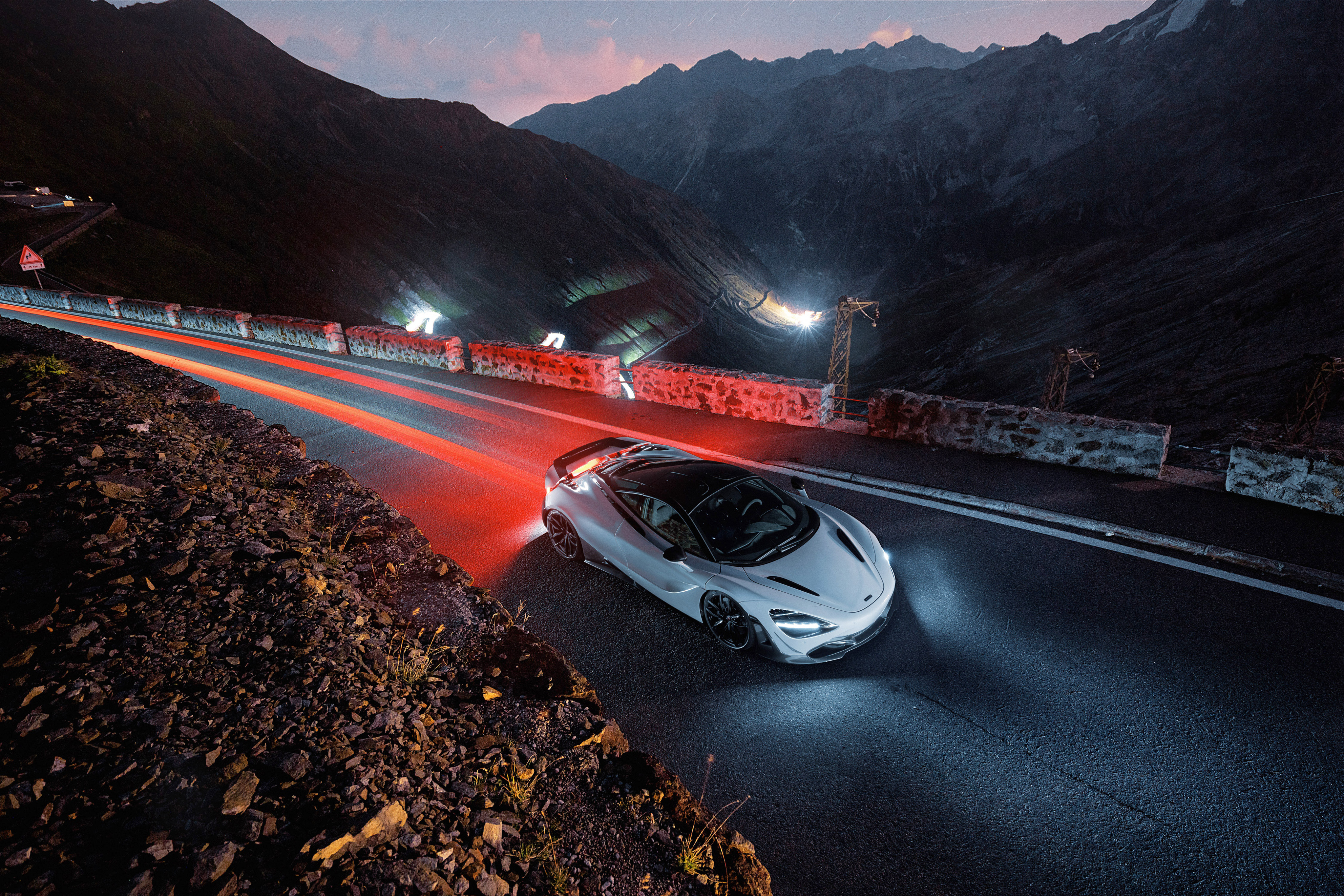 McLaren 720S driving on a mountain road at night HD Wallpaper