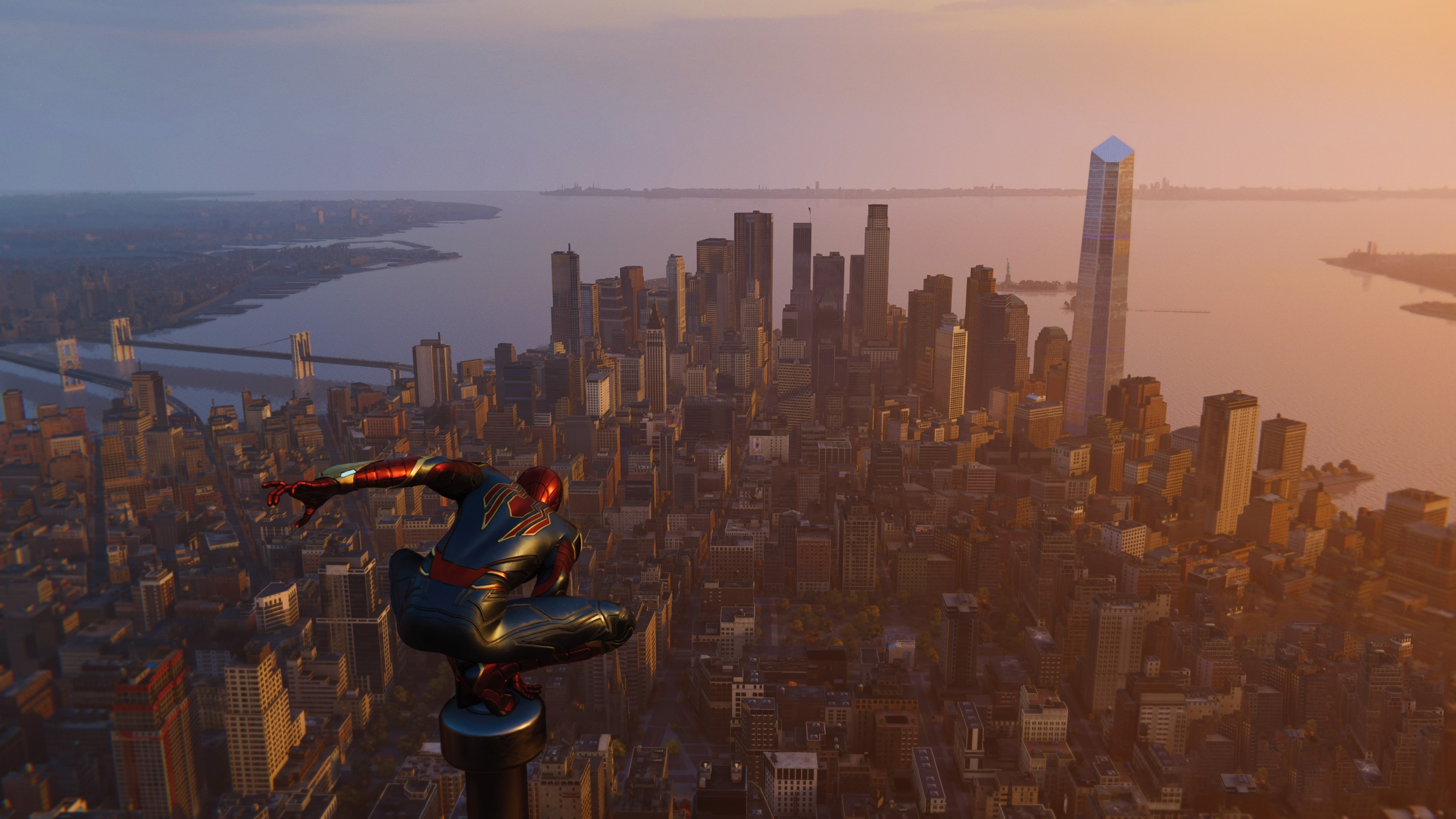 Spider-Man crouches on a skyscraper overlooking New York City HD Wallpaper