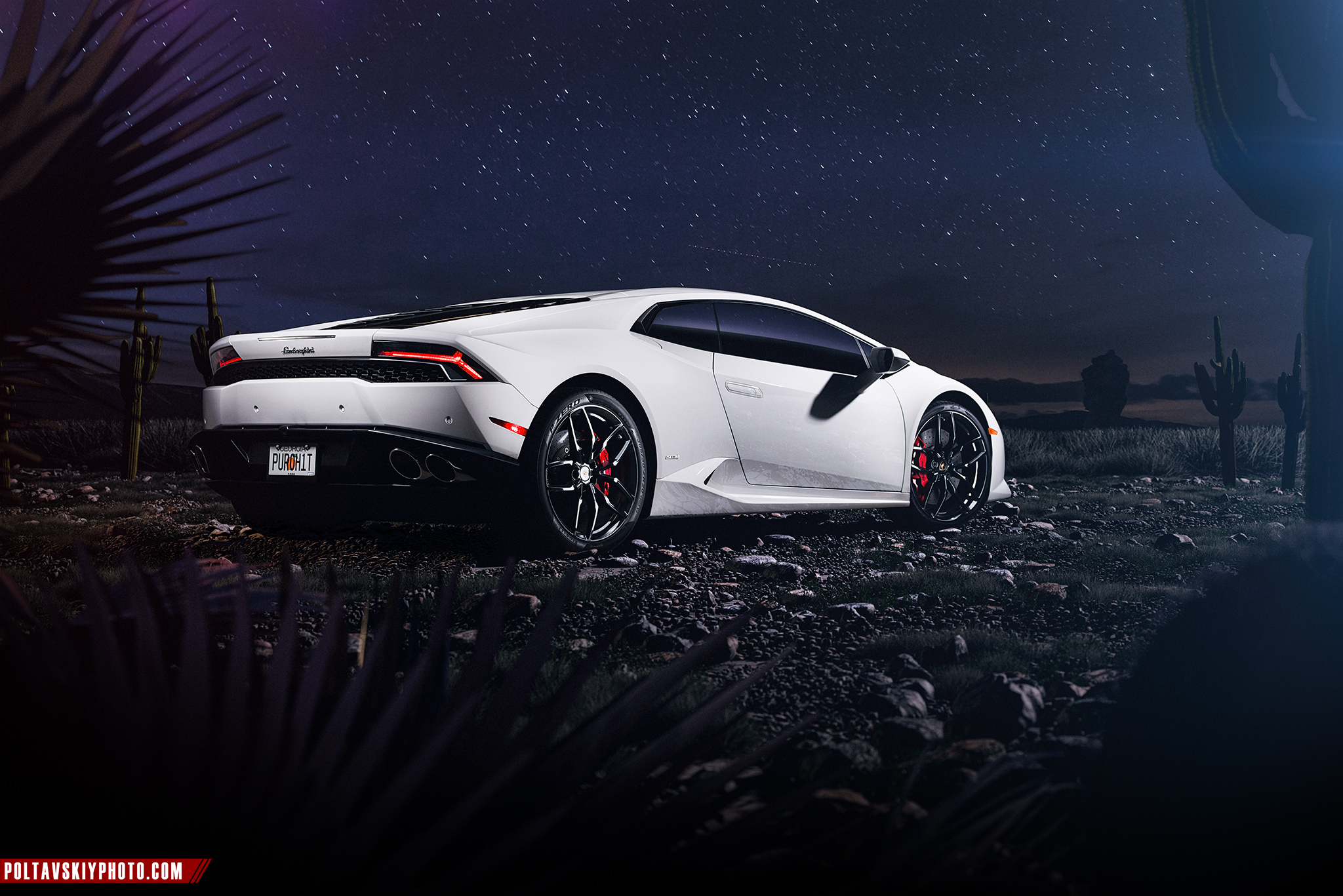 White Lamborghini Huracan parked at night under stars HD Wallpaper