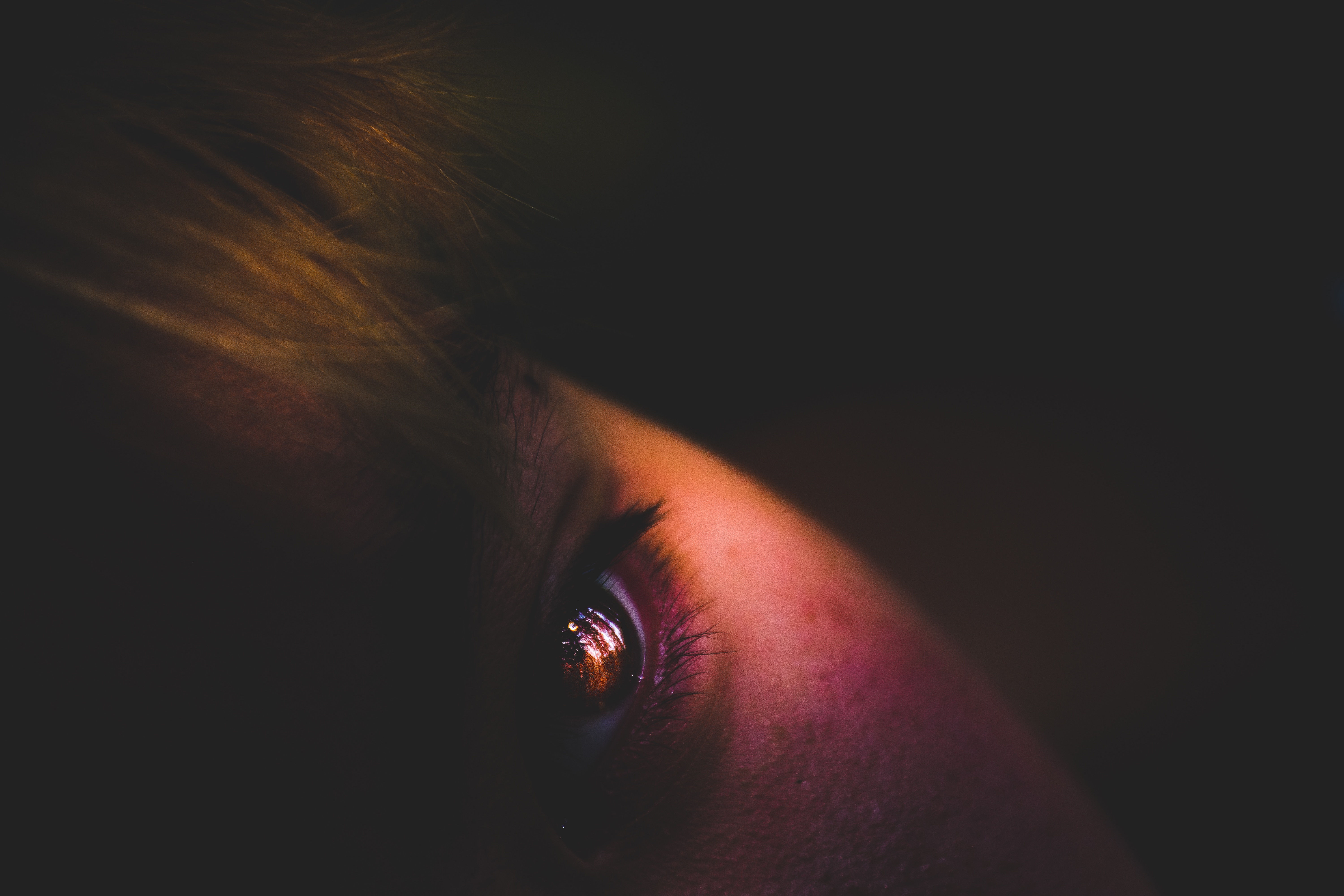 Close-up of a human eye with galaxy reflection HD Wallpaper