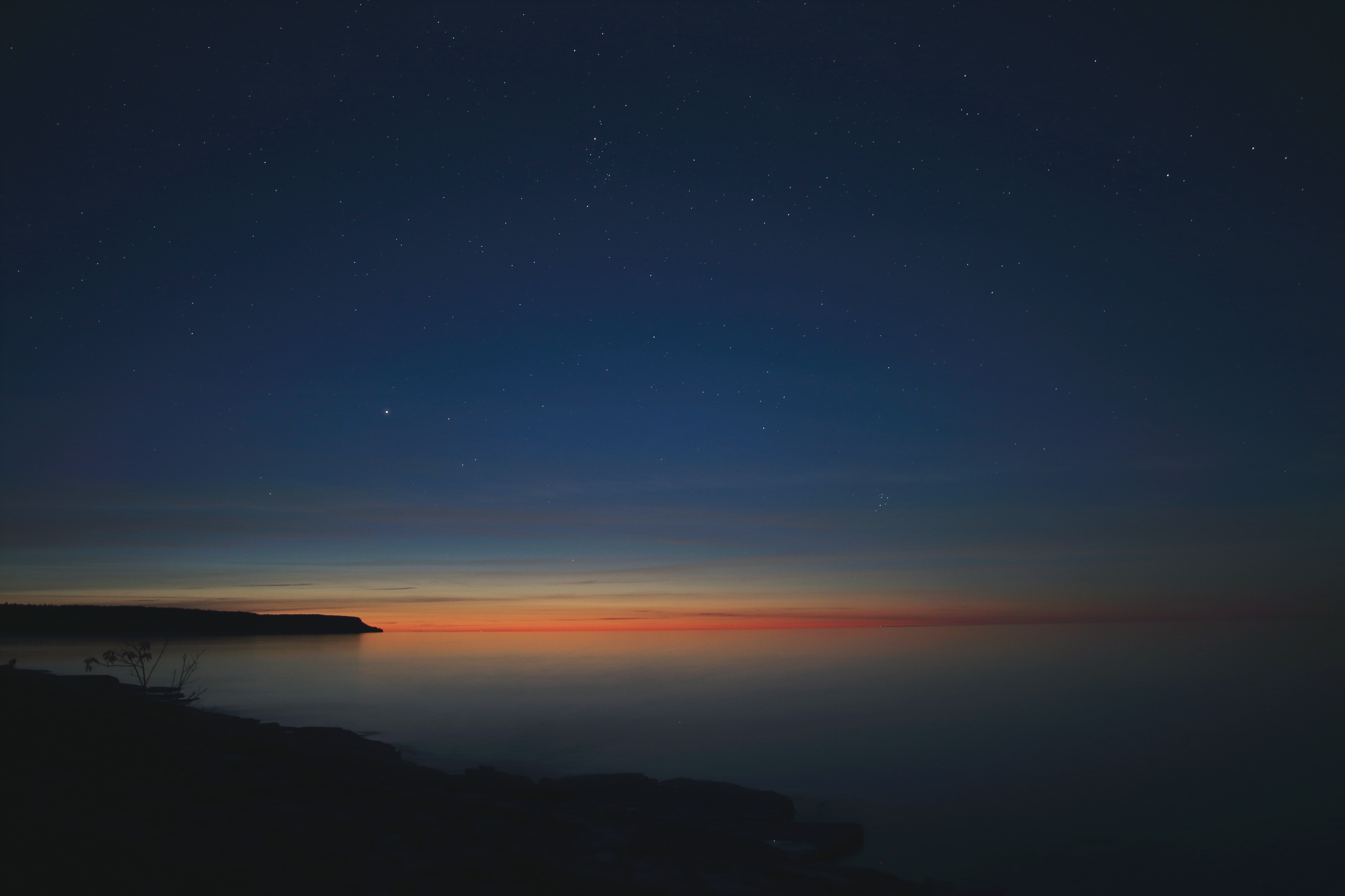 Sunset over the ocean with stars HD Wallpaper