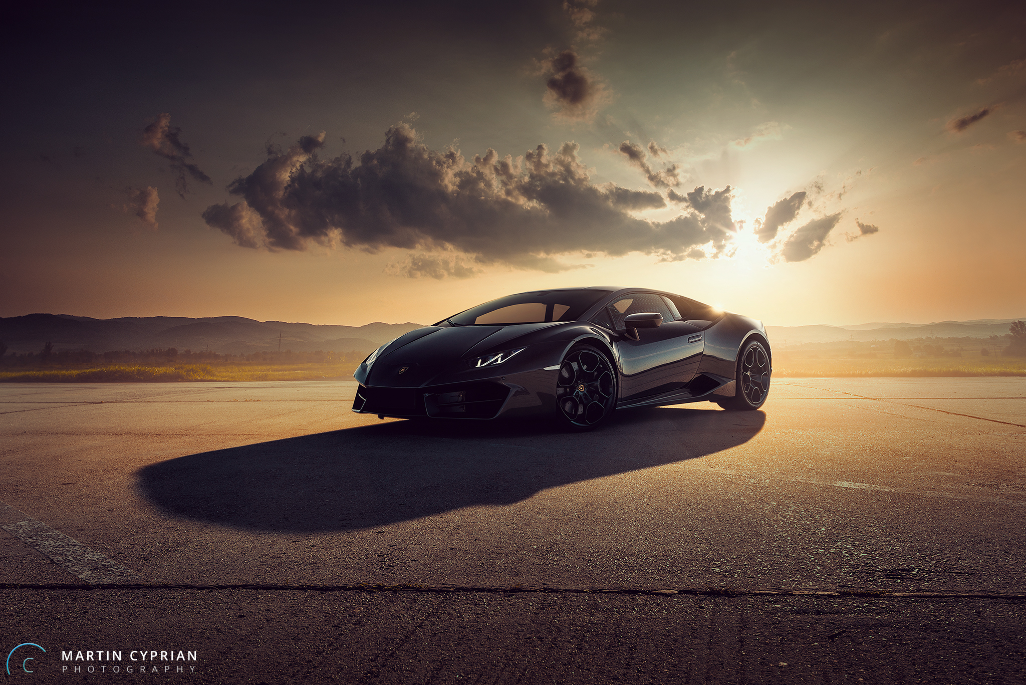 Black Lamborghini Huracan on a road at sunset HD Wallpaper