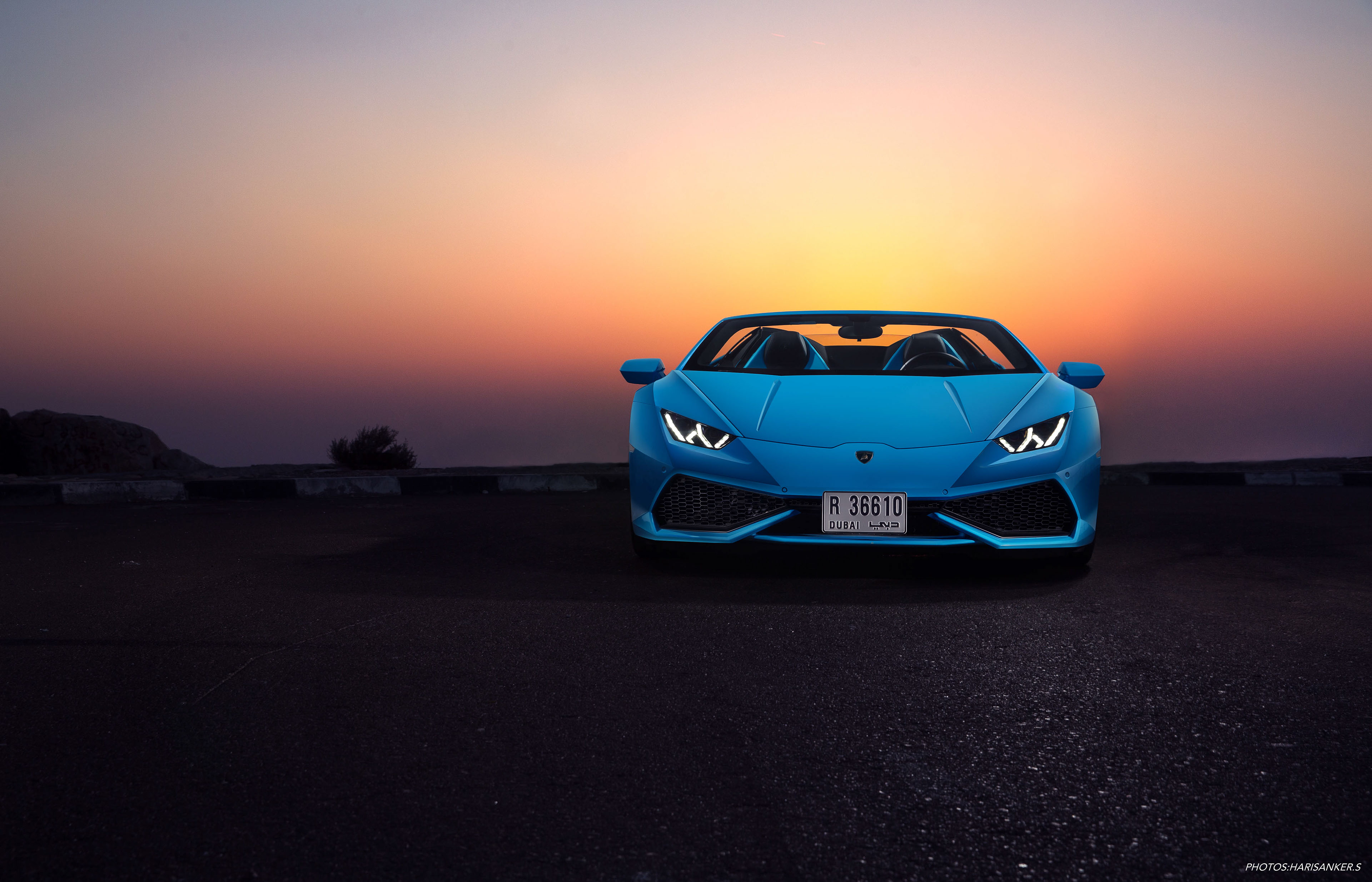 Blue Lamborghini Huracan convertible at sunset HD Wallpaper