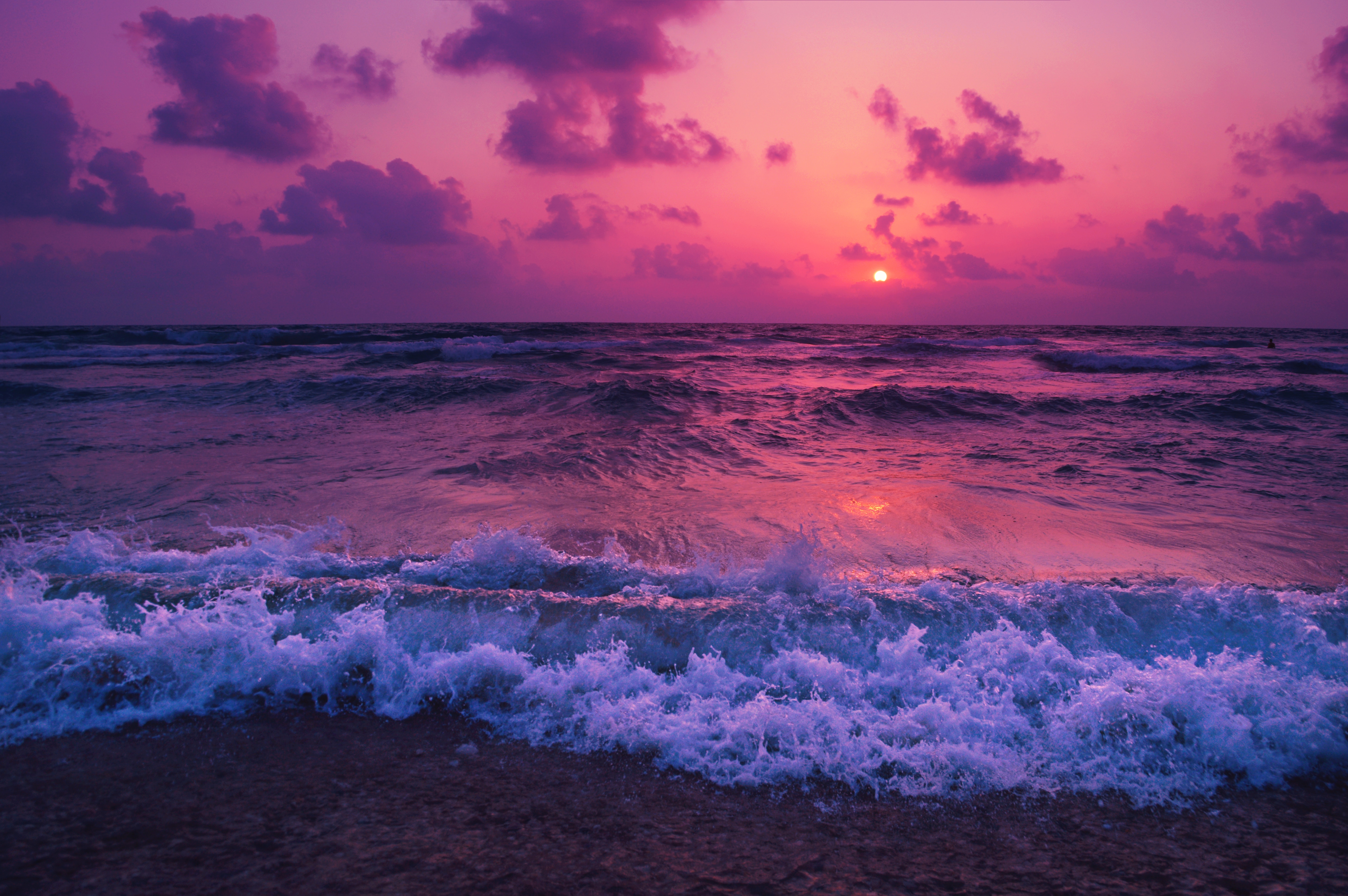 Waves crashing on shore during a purple sunset HD Wallpaper