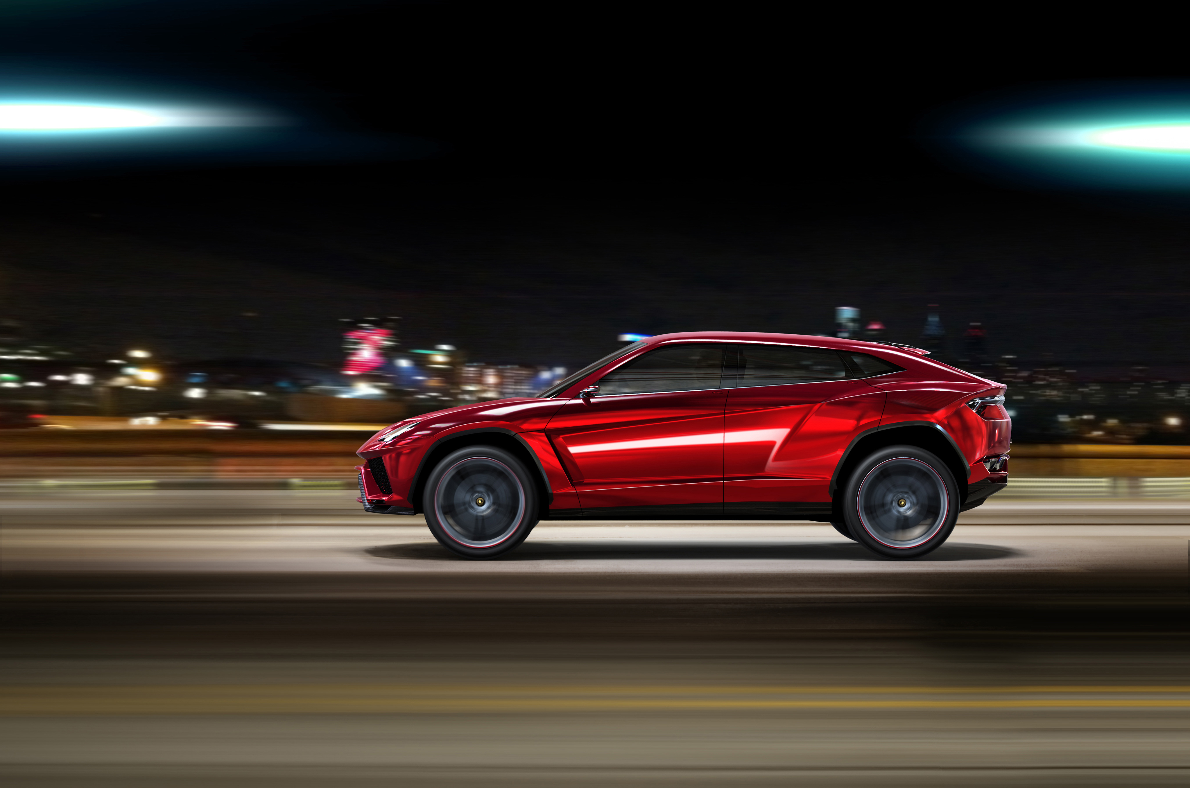Red Lamborghini Urus driving at night HD Wallpaper