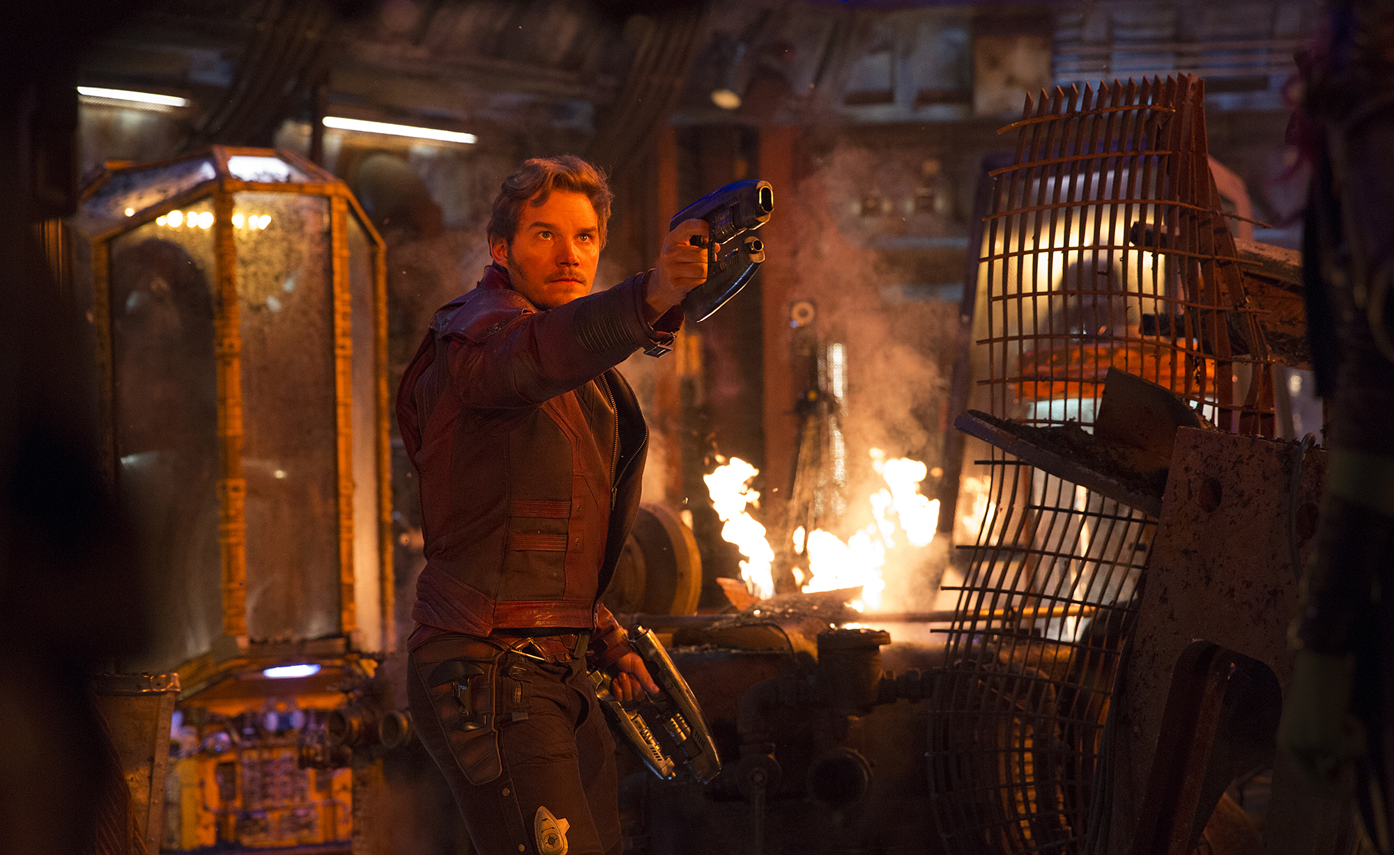 Star Lord holding guns in a fiery room HD Wallpaper