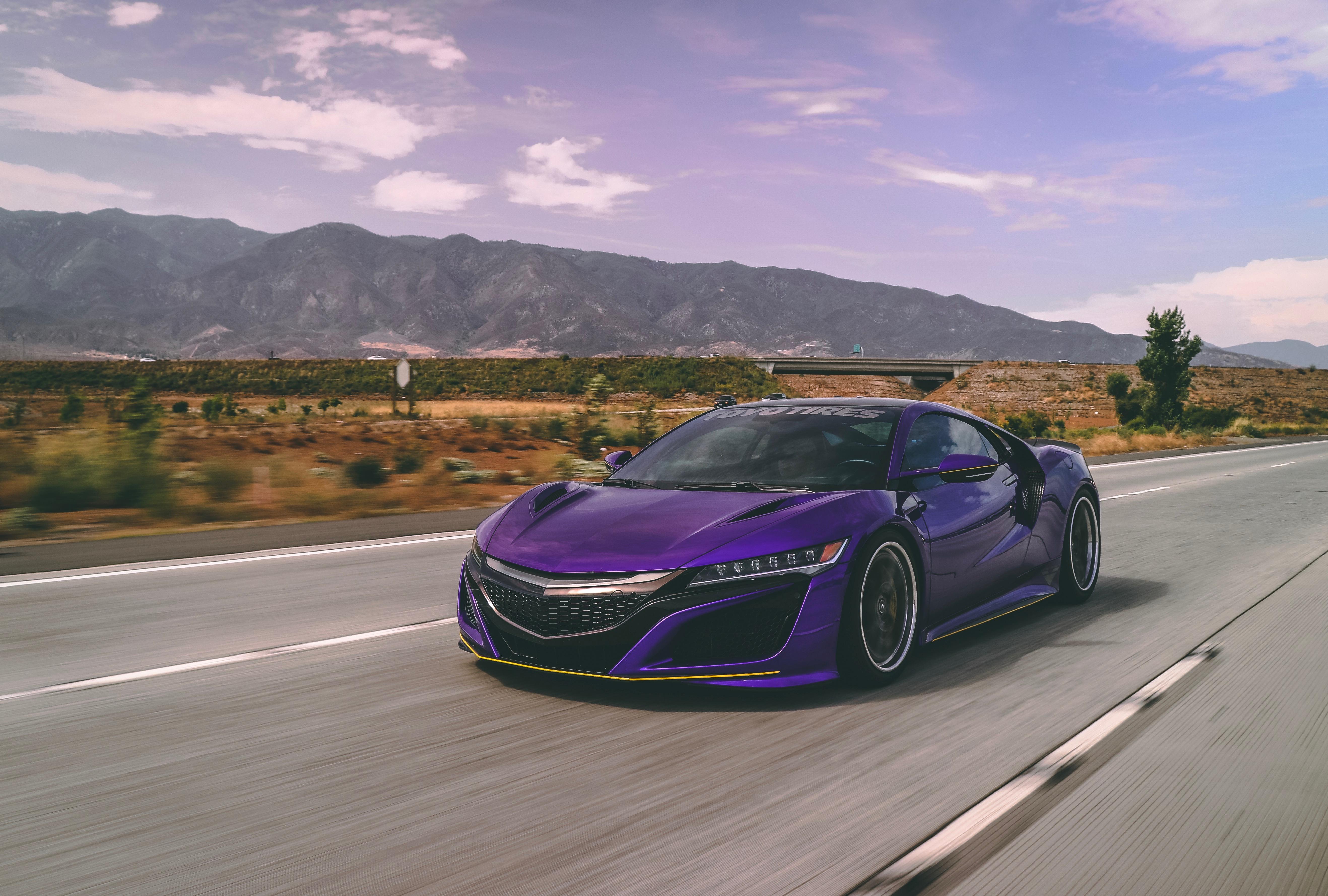 Purple Acura NSX driving on a highway HD Wallpaper