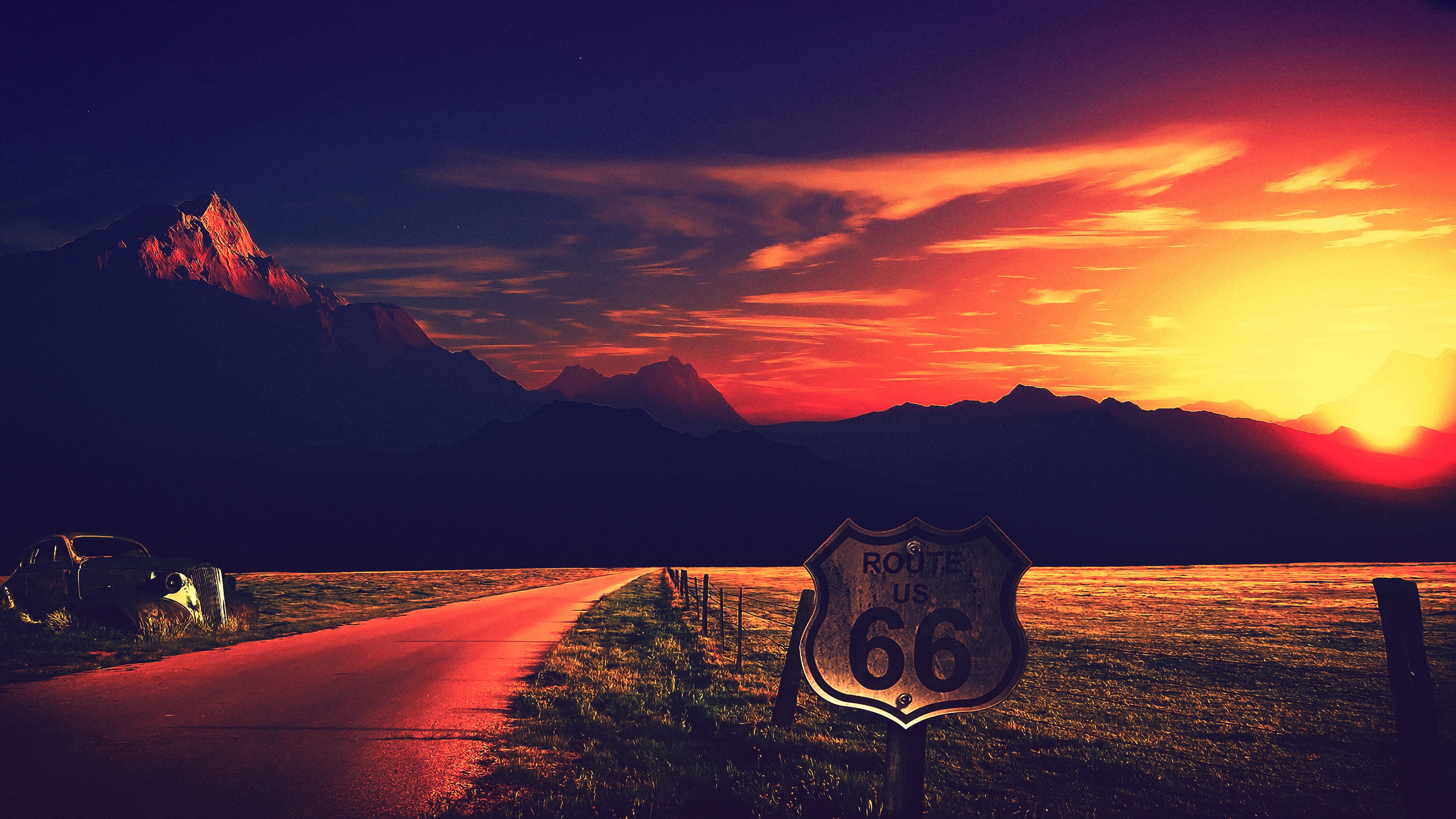 Route 66 sign at sunset with mountains HD Wallpaper