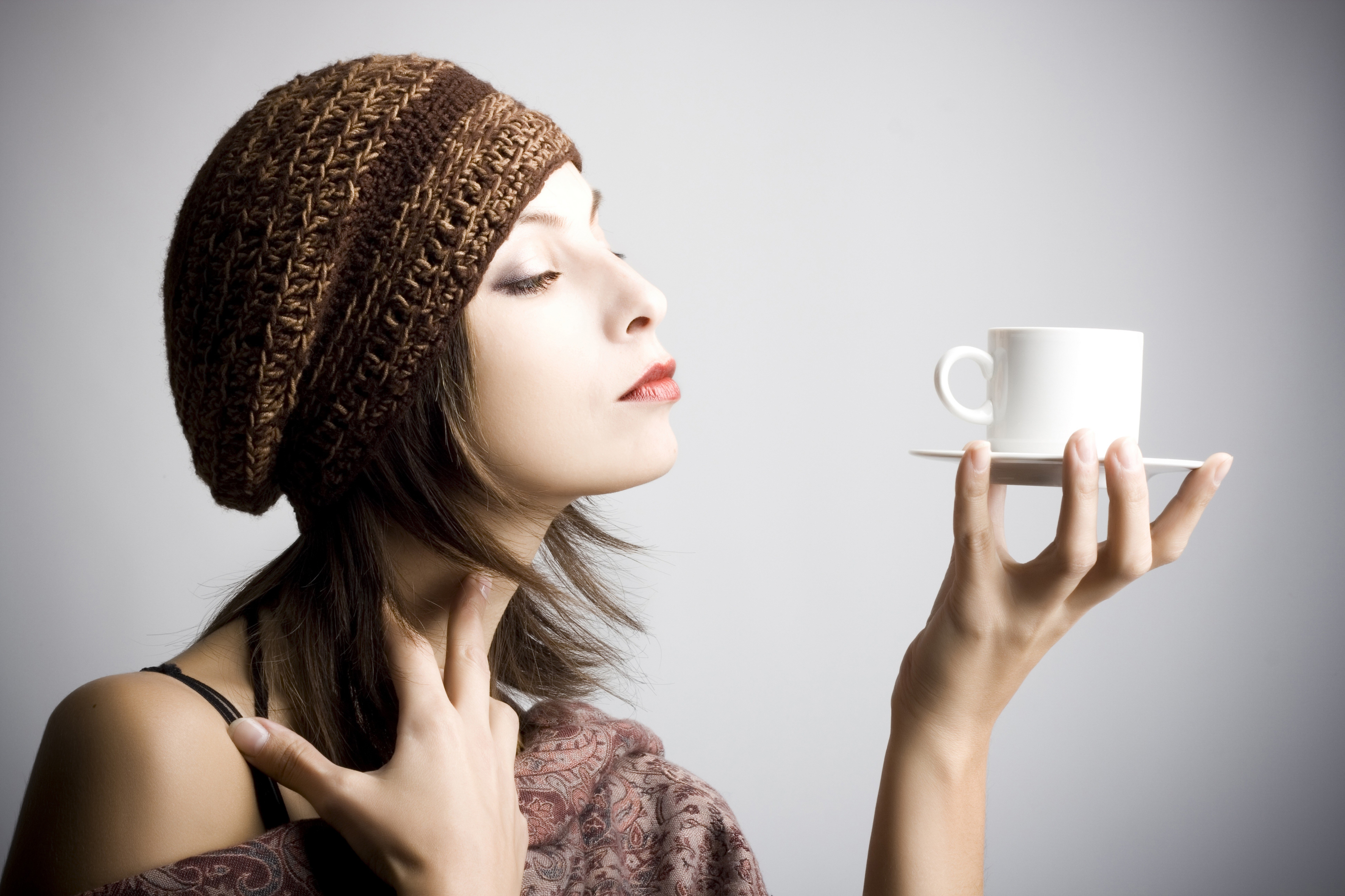Woman in Knit Hat Savoring Coffee Aroma HD Wallpaper