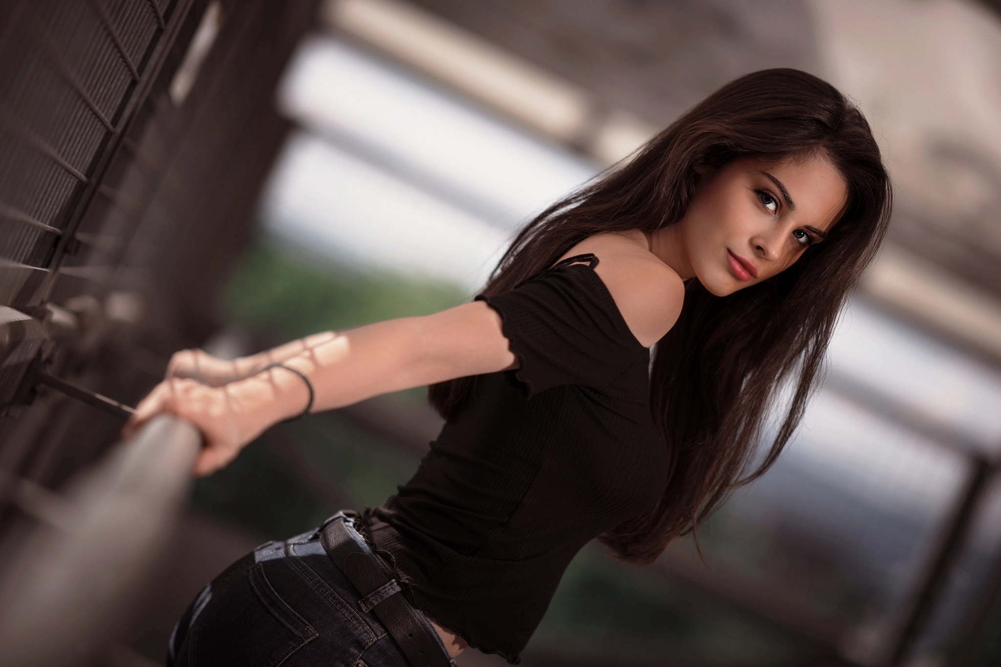 Woman with long dark hair wearing a black top HD Wallpaper