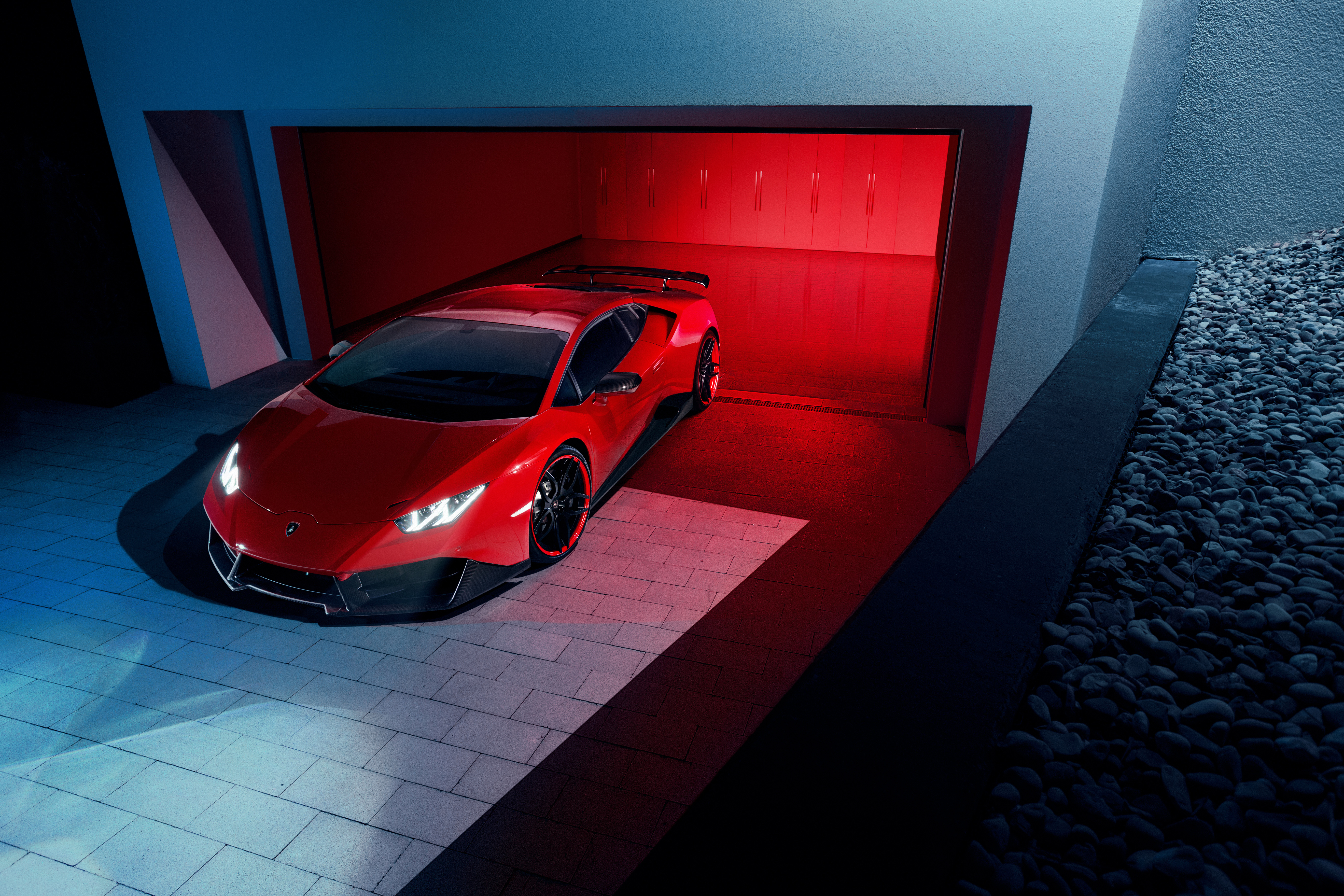 Red Lamborghini Huracan in a modern garage HD Wallpaper