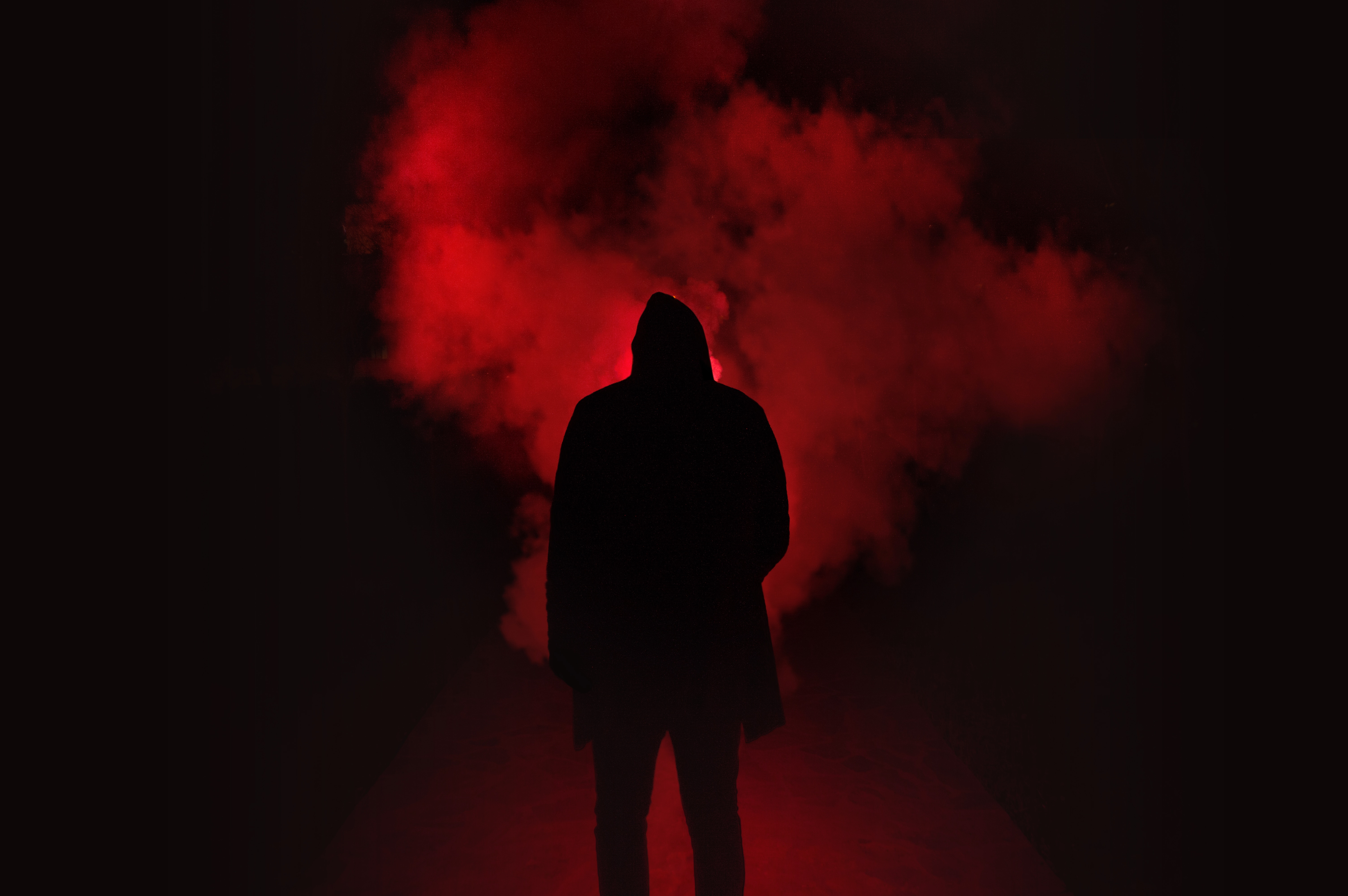 Person in silhouette with red smoke HD Wallpaper