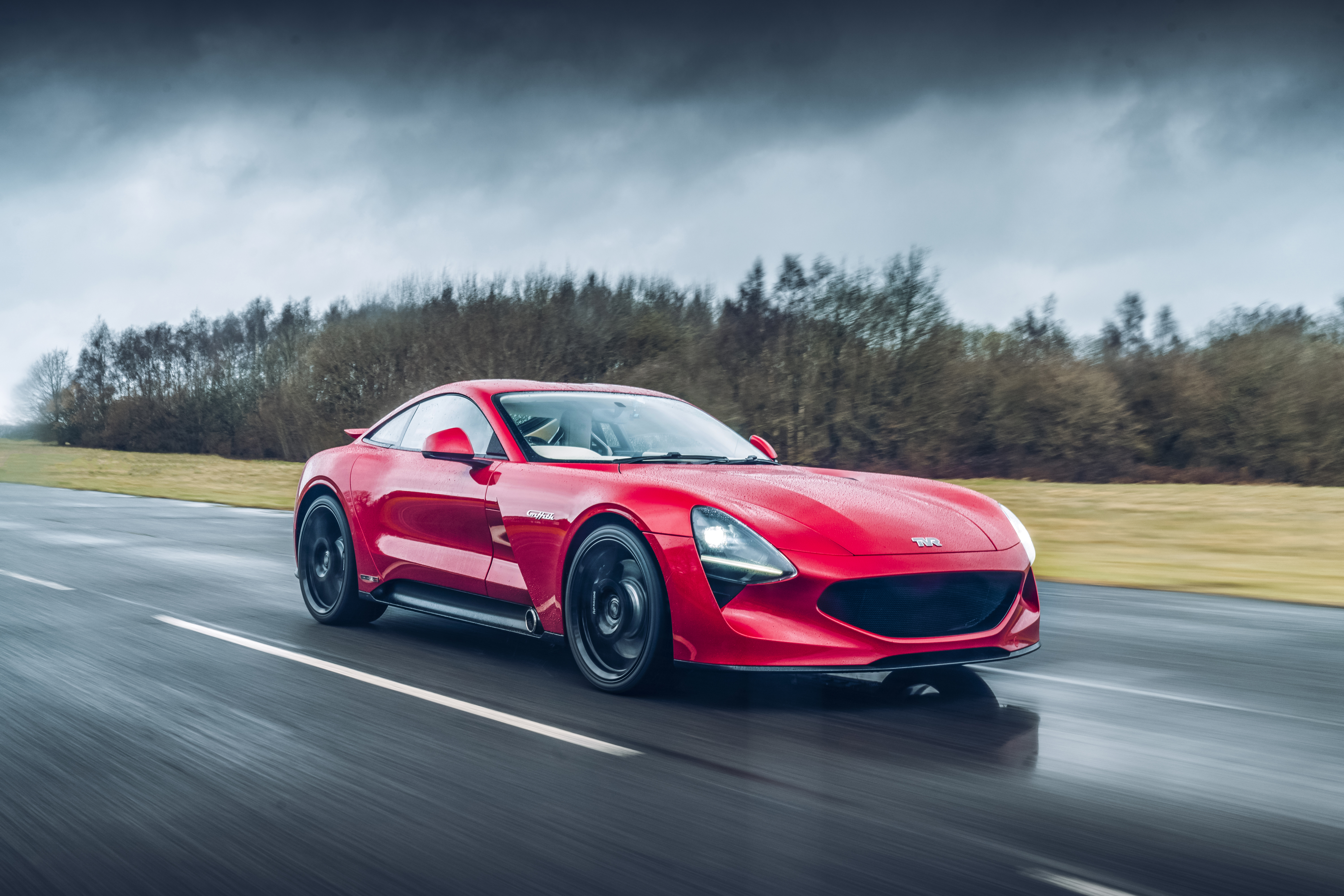 Red TVR Griffith driving on a wet road HD Wallpaper