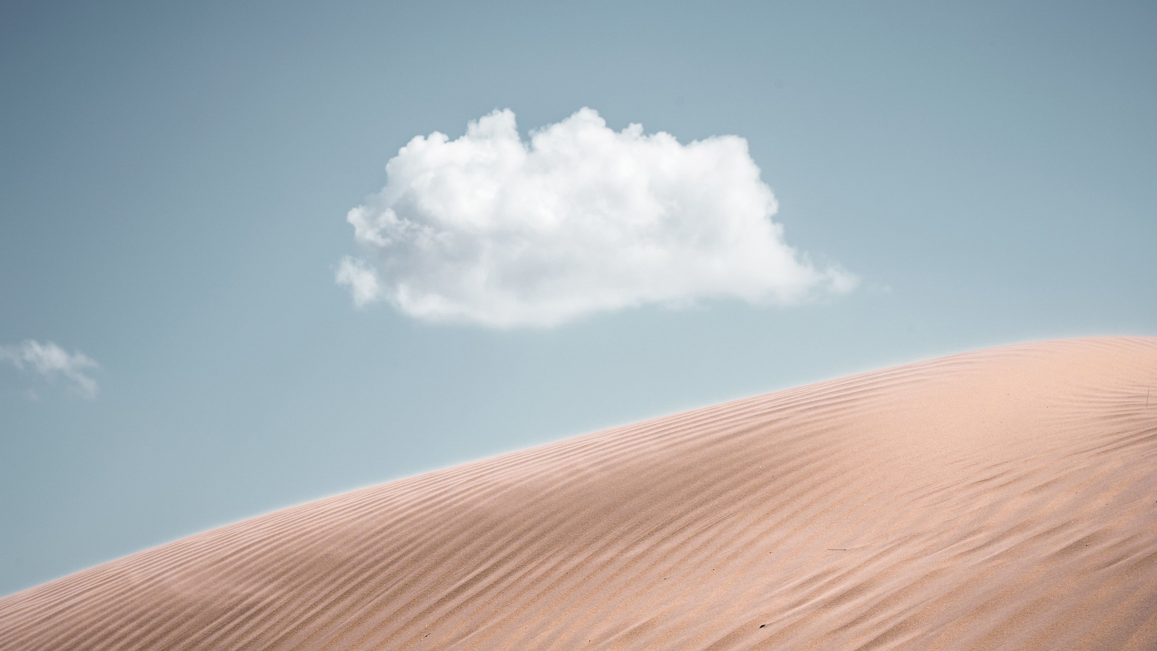 Desert sand dune with a single cloud in the sky HD Wallpaper