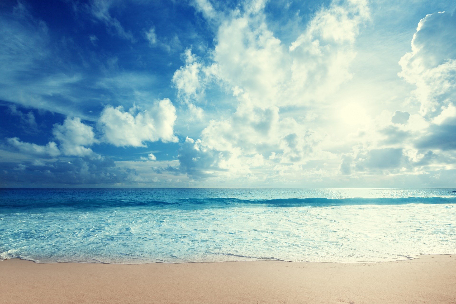 Beach with Ocean Waves and Cloudy Sky HD Wallpaper