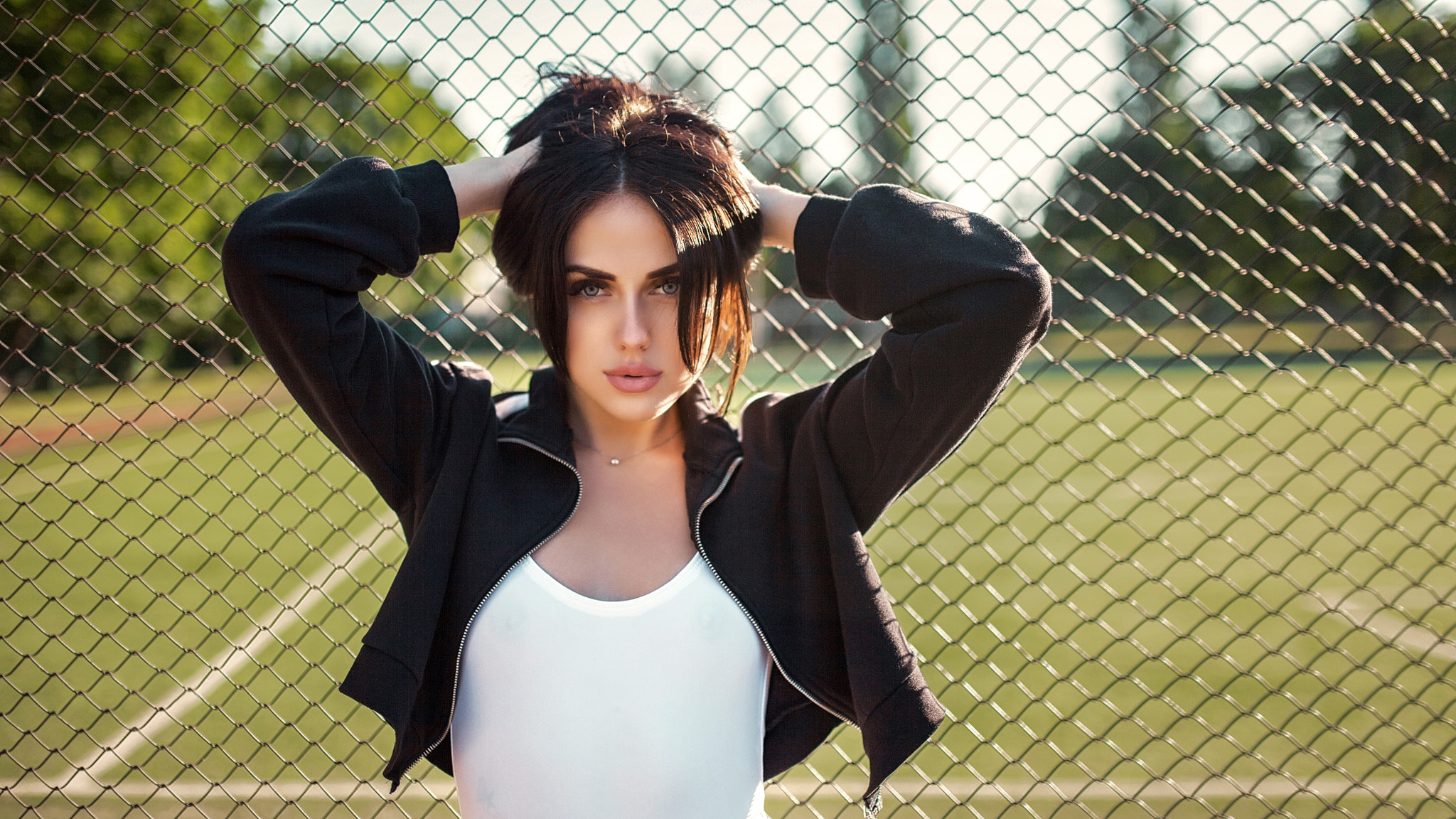 Woman in black jacket and white top outdoors HD Wallpaper